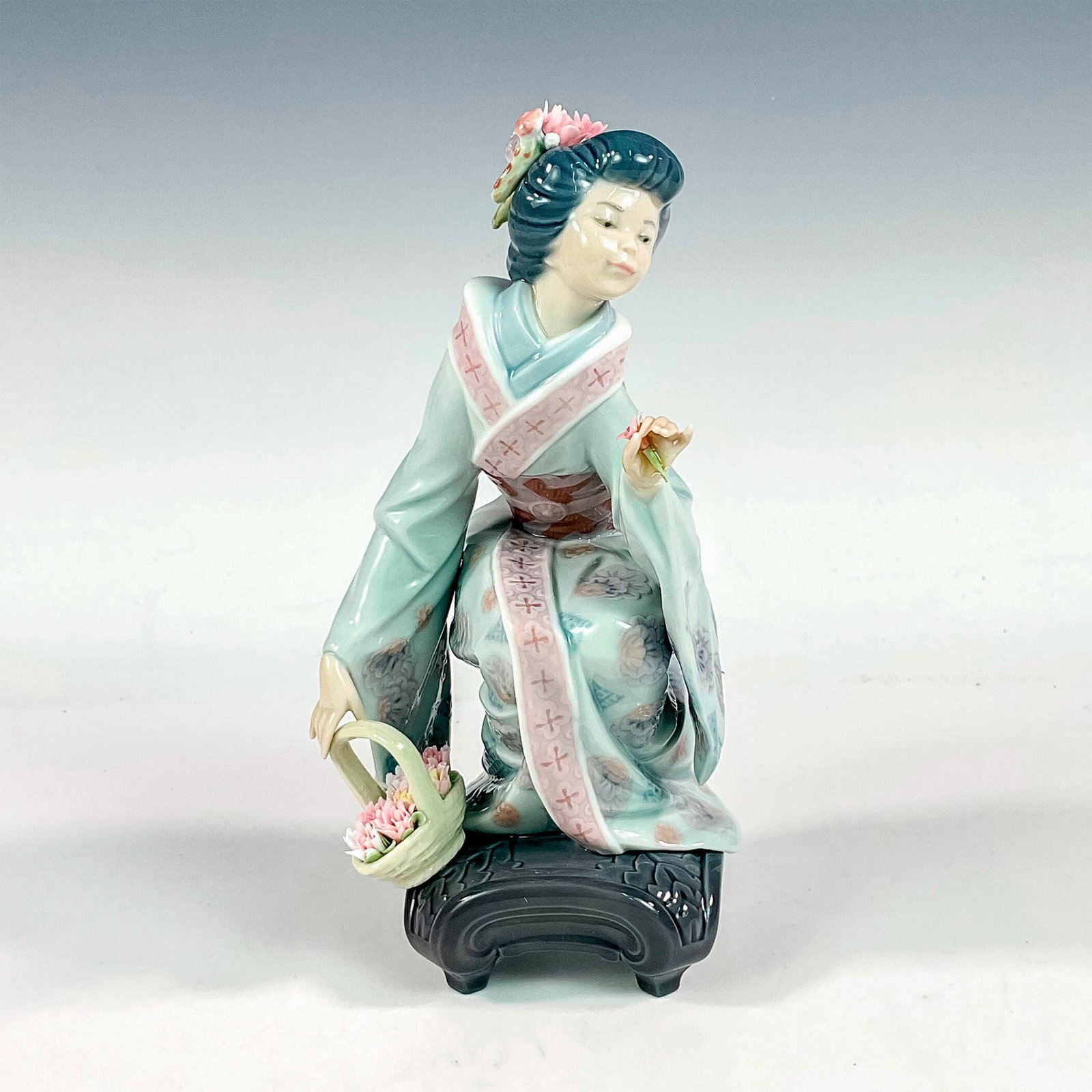 Yuki 1001448 - Lladro Porcelain Figurine: Glossy finish; Lladro backstamp. Artist: Salvador Debon Issued: 1983 - 1998 Dimensions: 7.75"H x 4"W Manufacturer: Lladro Country of Origin: Spain