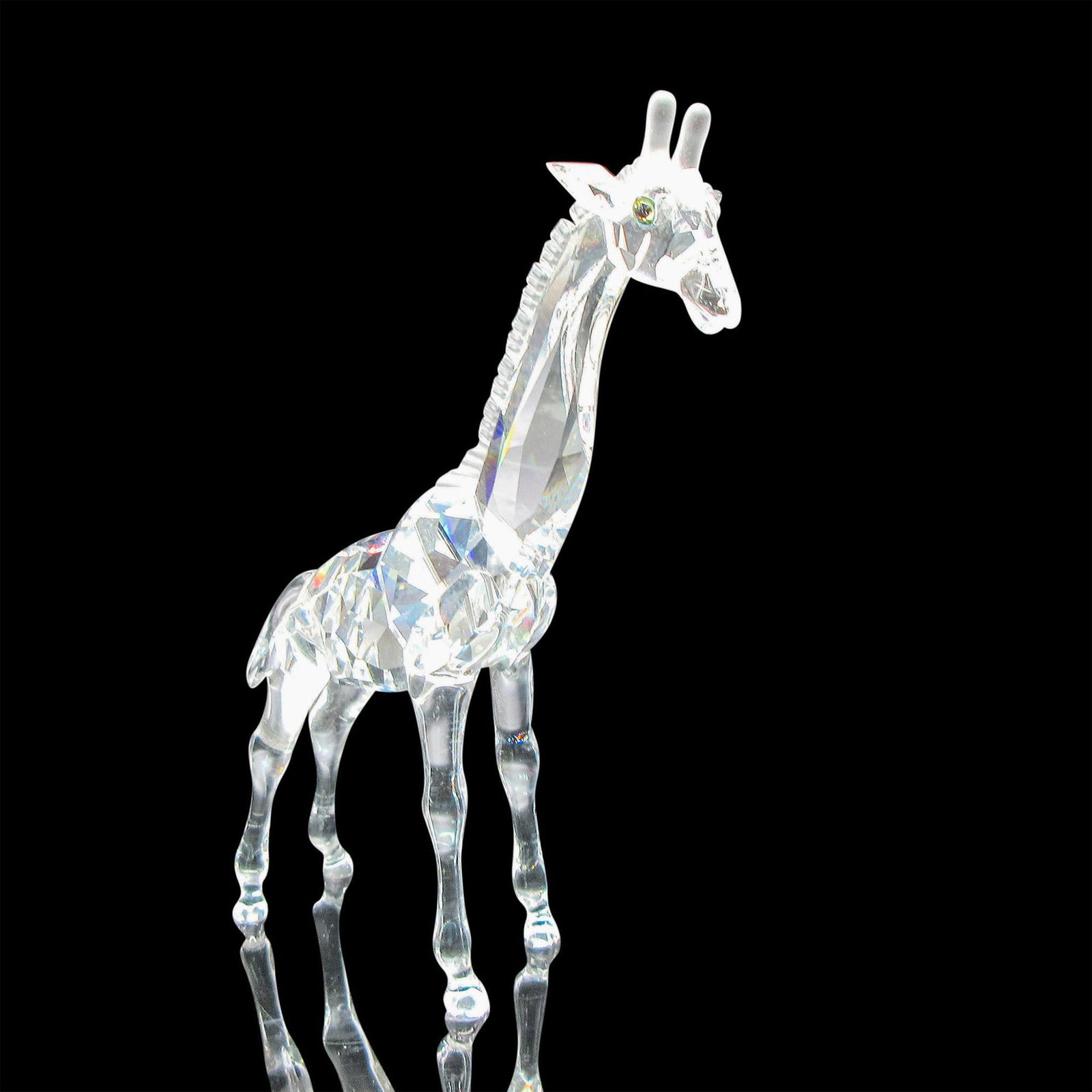 Swarovski Crystal Figurine, Giraffe: Brilliant cut crystal figure of a giraffe standing. Swarovski etched mark. 236717. Issued: 20th century Dimensions: 4"L x 1.25"W x 5.25"H Manufacturer: Swarovski Country of Origin: Austria
