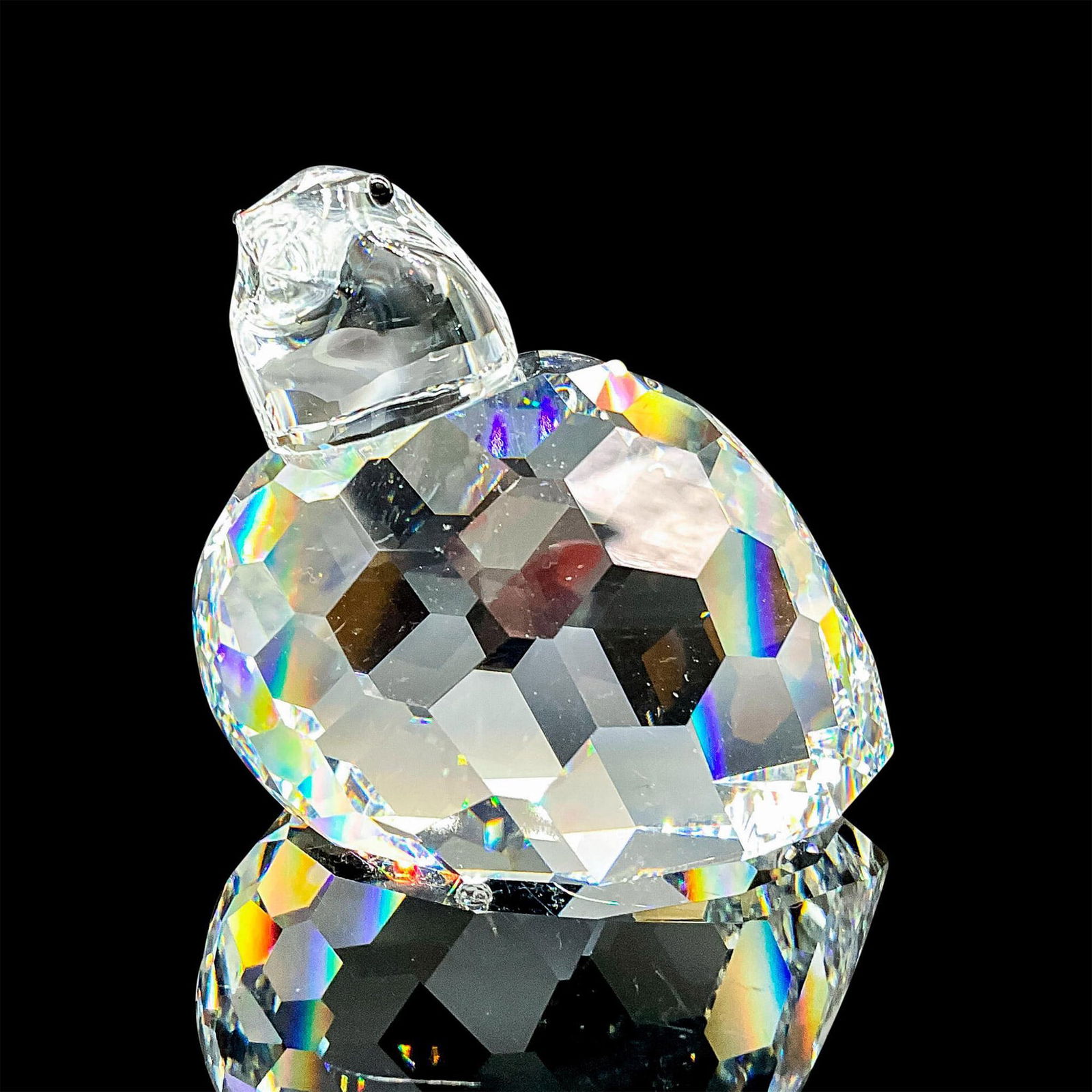 Swarovski"â„¢s Silver Crystal Figurine, Partridge: Lead crystal quail made with jet crystal eyes. Swarovski etched backstamp. This item has its original box. Box measures: 4.75"W x 4"H. Artist: Adi Stocker Issued: 1998-1990 Dimensions: 2.25"W x 2.25"H