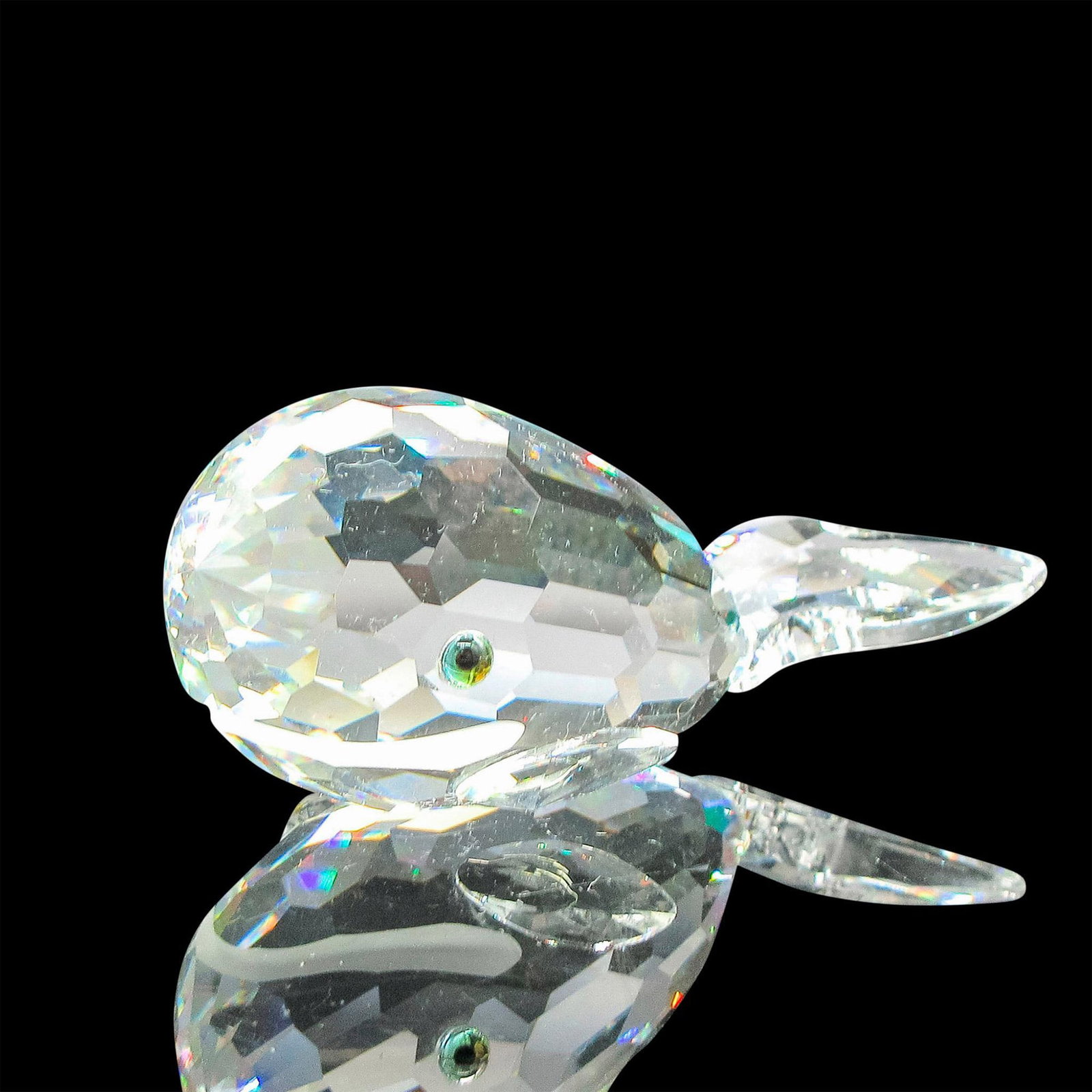 Swarovski Silver Crystal Figurine, Whale: Marked as early registration gift for the 1990 DC Gala. Figural has clear faceted body with frosted mouth and colored eyes. Swarovski backstamp. 7628080000. This item has its original box: 3.25"L x 3.