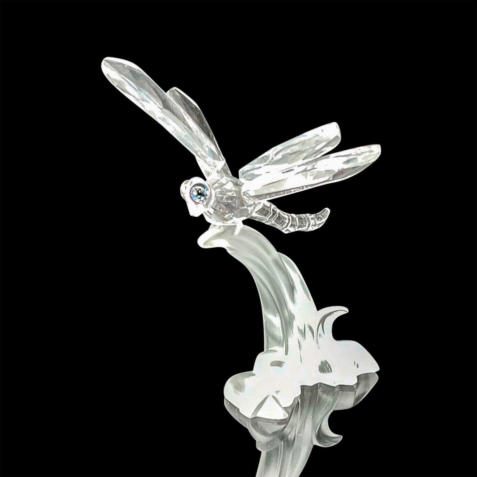 Swarovski Crystal Figurine, Dragonfly: Swarovski Among Flowers and Foliage Dragonfly The dragonfly is bright and the branch is frosted. This item was originally in the Among Flowers and Foliage theme group, later moving to In the Secret Ga