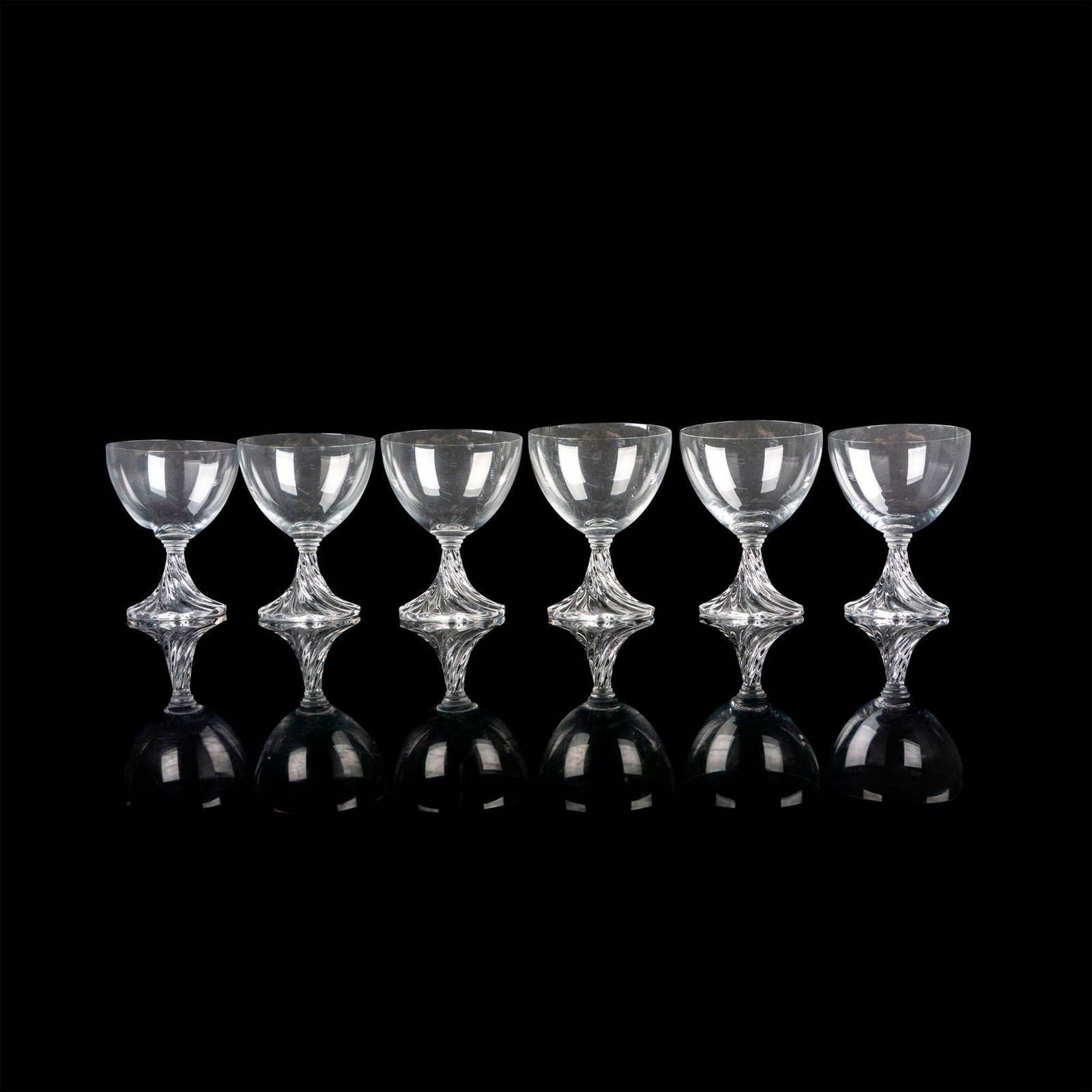 6pc Lalique Sherry Glasses. Rambouillet: A set of 6 clear drinkware with a swirl stem. Lalique France etched on base. Issued: c. 1981-1991 Dimensions: 3"W x 3.75"H Manufacturer: Lalique Country of Origin: France Provenance: Collection o