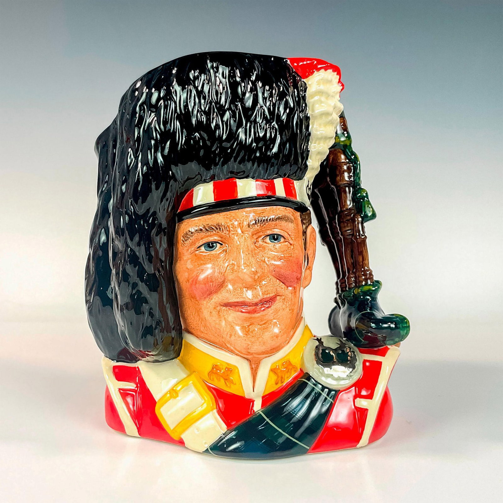 Piper D6918 - Large - Royal Doulton Character Jug: Black, red, white and yellow coloration. Issued 1992 in a limited edition of 2,500 pieces. Royal Doulton backstamp. Artist: Stanley J. Taylor Issued: 1992 Dimensions: 8.25"H Edition Number: 785 Editi
