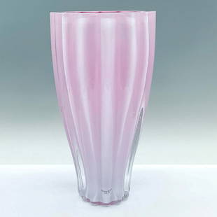 Kosta Boda Ann Wahlstrom Art Glass Vase, Hot Pink, Signed: A beautiful rippled sculpted vase. A cerise-pink glass interior and a pastel-rose color exterior with a clear overlay. Artist signed on the base. Kosta Boda sticker on the side. Artist: Ann Wahlstrom