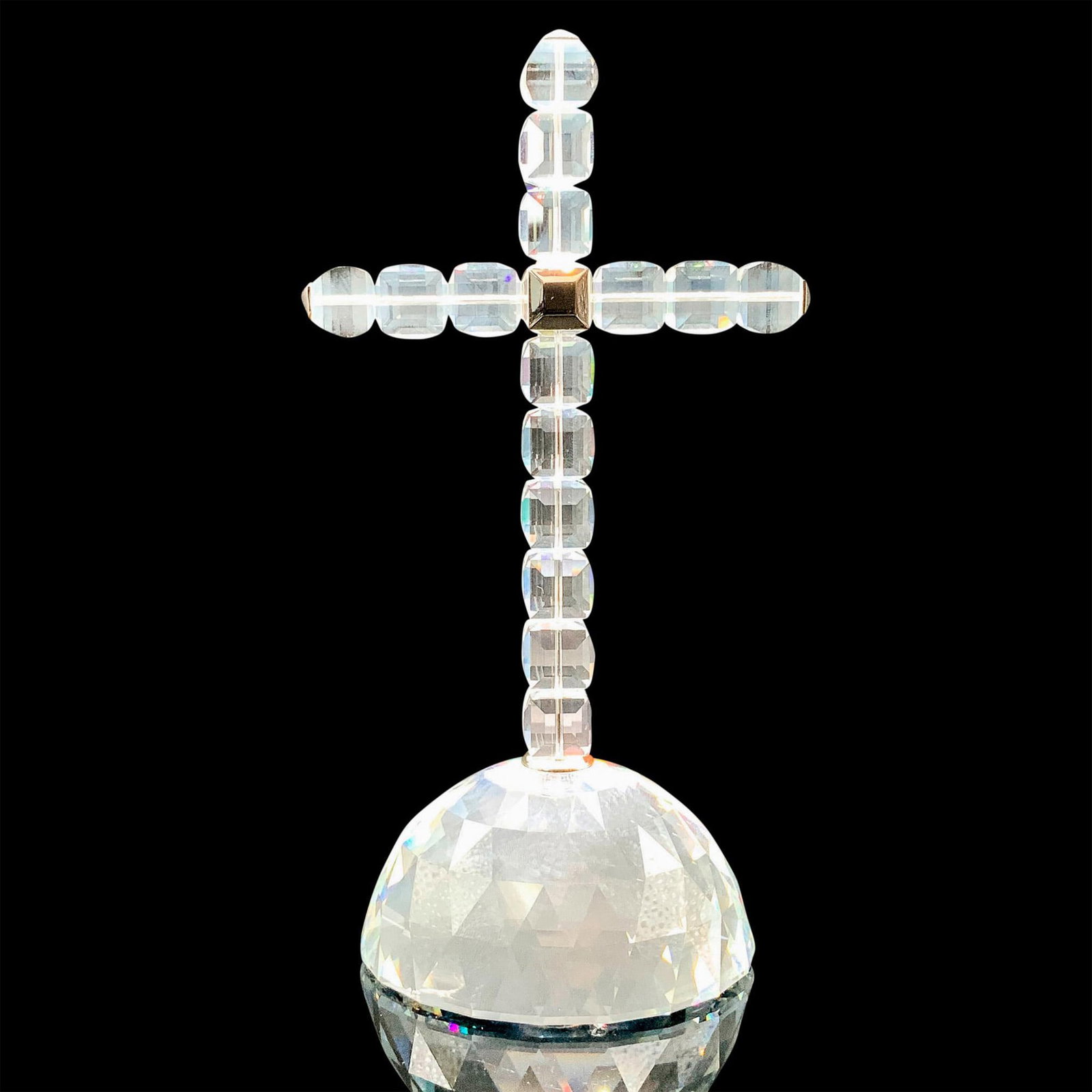 Swarovski Crystal Figurine, Cross of Light: A clear crystal figure of a cross made of multiple square crystals connected by rhodium with a crystal circular base. Swarovski backstamp. This item has its original box. Dimensions of the original bo