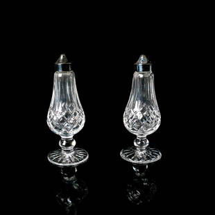 Waterford Crystal Footed Shaker Set: Crystal pattern "Lismore" salt and pepper shakers hand cut pair with metal lids. Waterford backstamp. Dimensions: 6.25"H x 2.5" dia. Manufacturer: Waterford Country of Origin: Ireland