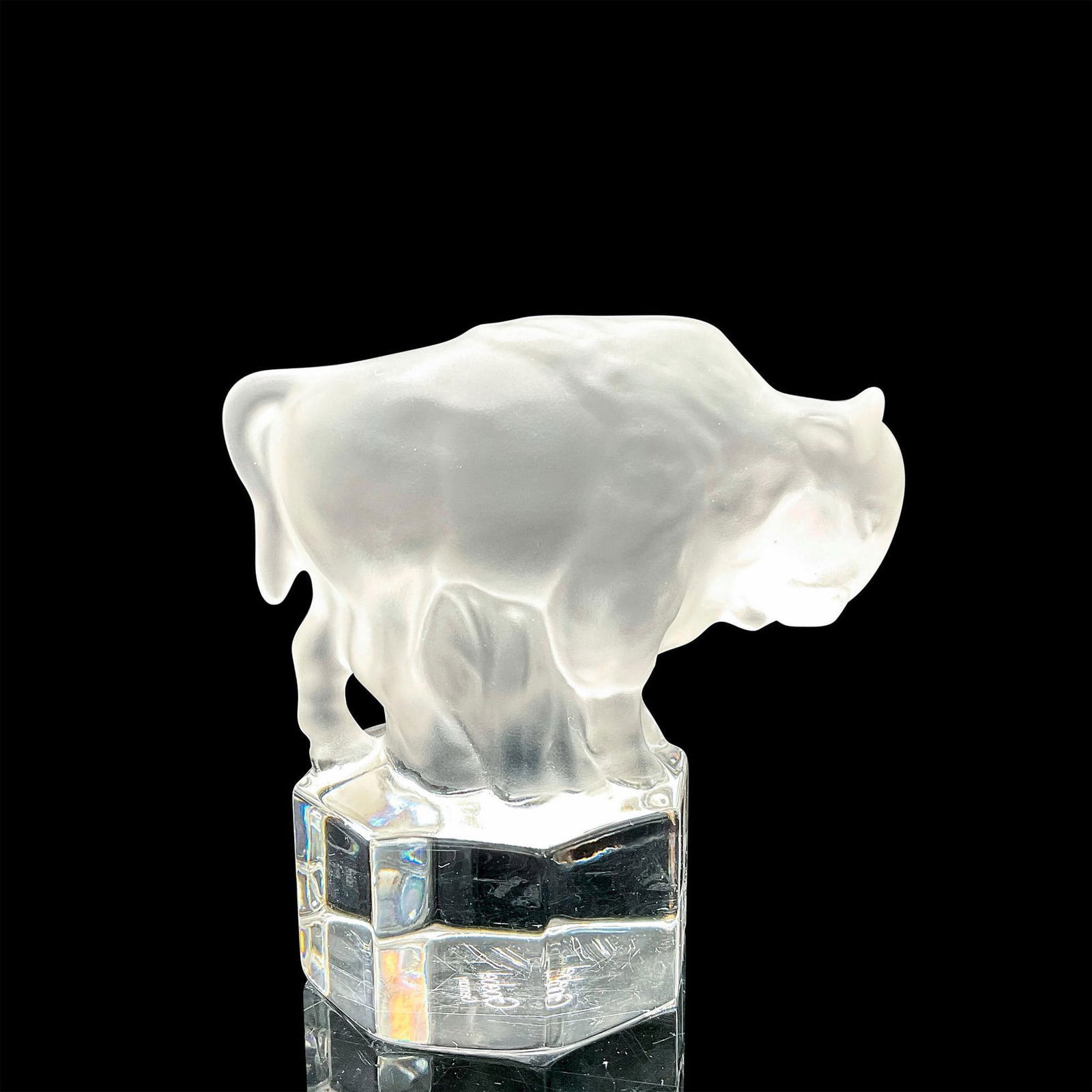 Goebel Hummel Crystal Paperweight, Buffalo: Frosted crystal buffalo mounted on a clear crystal octagon shape base. Goebel Hummel acid backstamp. Dimensions: 2"L x 3.25"W x 3.54"H Manufacturer: Goebel Hummel Country of Origin: Germany