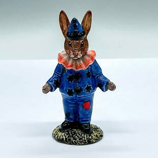 Royal Doulton Bunnykins Colorway Figurine, Clown DB128: Blue costume with black stars and pompons, red square patch on the trousers, and red ruff on the neck. Royal Doulton backstamp. Artist: Denise Andrews and Warren Platt Issued: c. 1992 Dimensions: 2.5"