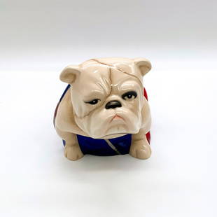 Royal Doulton Bulldog Figure, Spectre Jack DD007M: Glossy finish. Cream seated bulldog with Union Jack flag. Appeared in the 2015 James Bond film Spectre. Royal Doulton and Spectre backstamp. Issued: 2015 Dimensions: 6"L x 3.25"W x 3.75"H Manufacturer