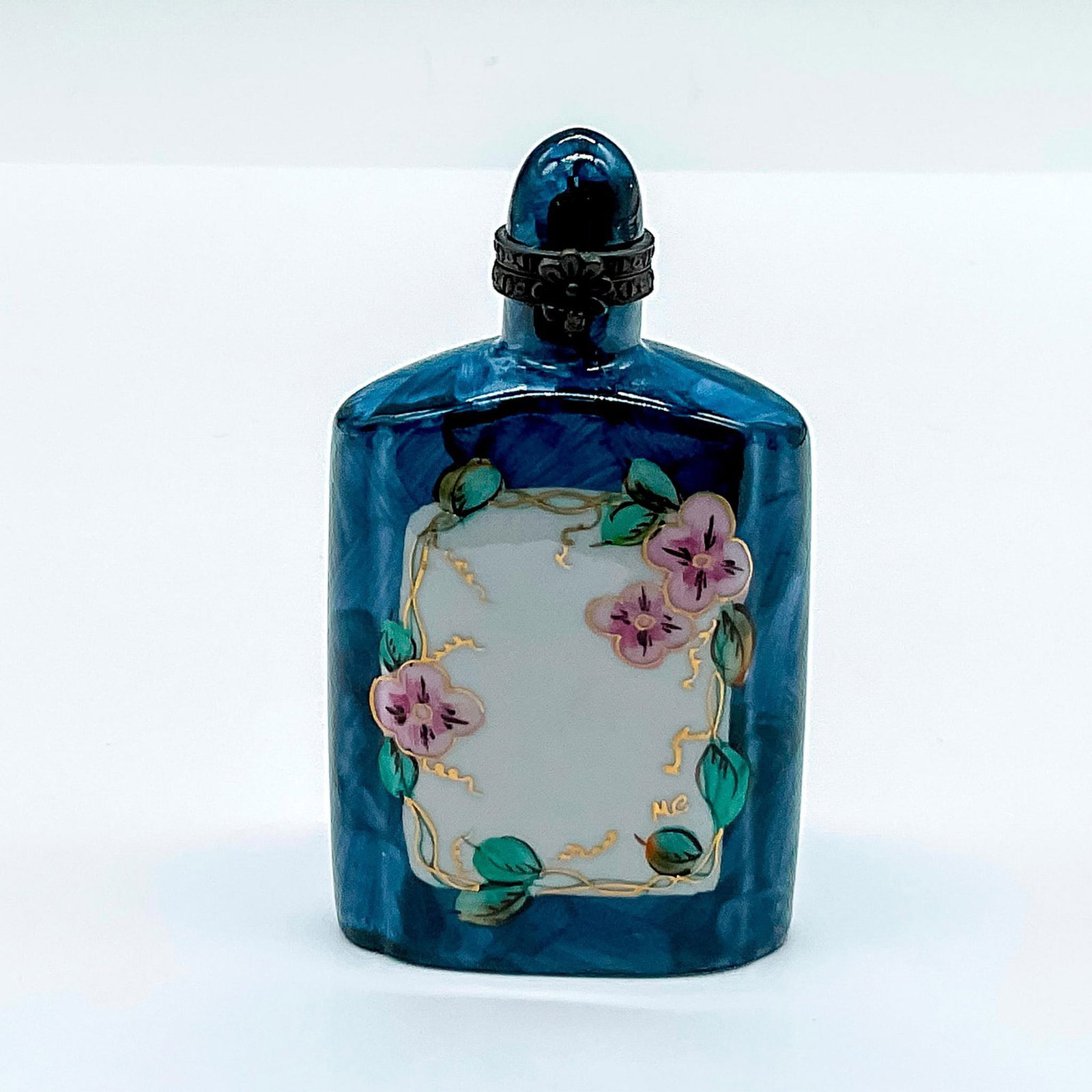 Rochard Limoges Porcelain Bottle: Hand painted blue box shaped as a bottle adorned with pink flowers. Rochard Limoges France Hand Painted marked on the base. Issued: 20th century Dimensions: 2"L x 1"W x 3.25"H Manufacturer: Rochard Li