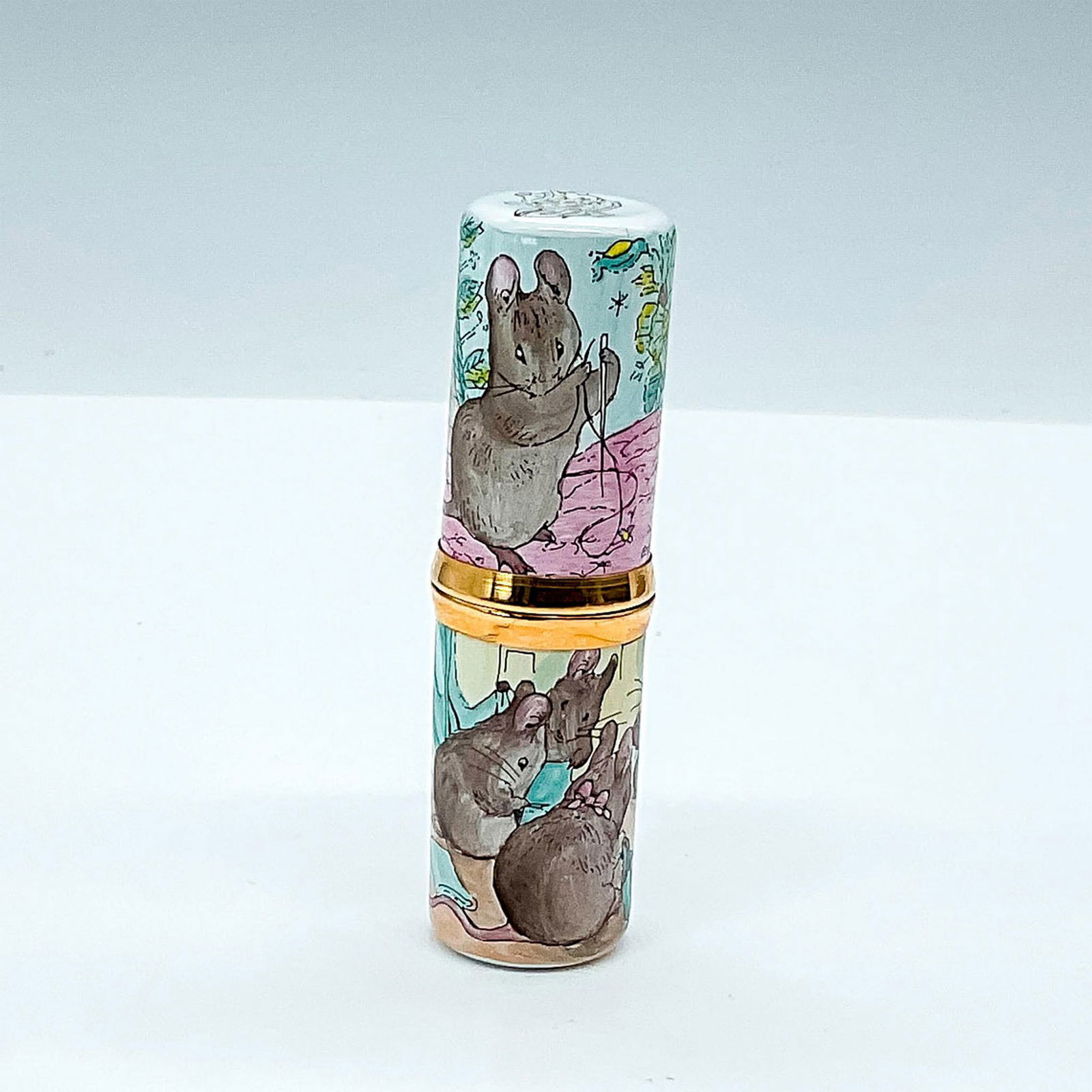 Crummles English Enamels Two Bad Mice Needle Holder: Beatrix Potter collector's item featuring characters Tom Thumb and Hunca Munca from The Tale of Two Bad Mice. Multicolored hand painted needle case with gold hardware. Spool of string, scissors and th