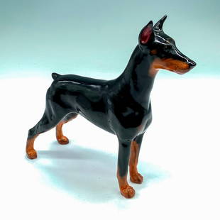 Royal Doulton Dog Figurine, Doberman Pinscher HN2645: Glossy black and brown coloration. Modeled after champion show dog, Rancho Dobe's Storm. Royal Doulton backstamp. Artist: Peggy Davies Issued: 1955-1985 Dimensions: 6.25"L x 2.25"W x 6"H Manufacturer: