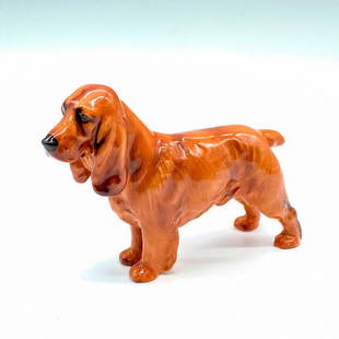 Royal Doulton Dog Figurine, Cocker Spaniel HN1188: Glossy brown finish; Royal Doulton backstamp. Artist: Frederick Daws Issued: 1937-1960 Dimensions: 5"L x 1.5"W x 3.25"H Manufacturer: Royal Doulton Country of Origin: England