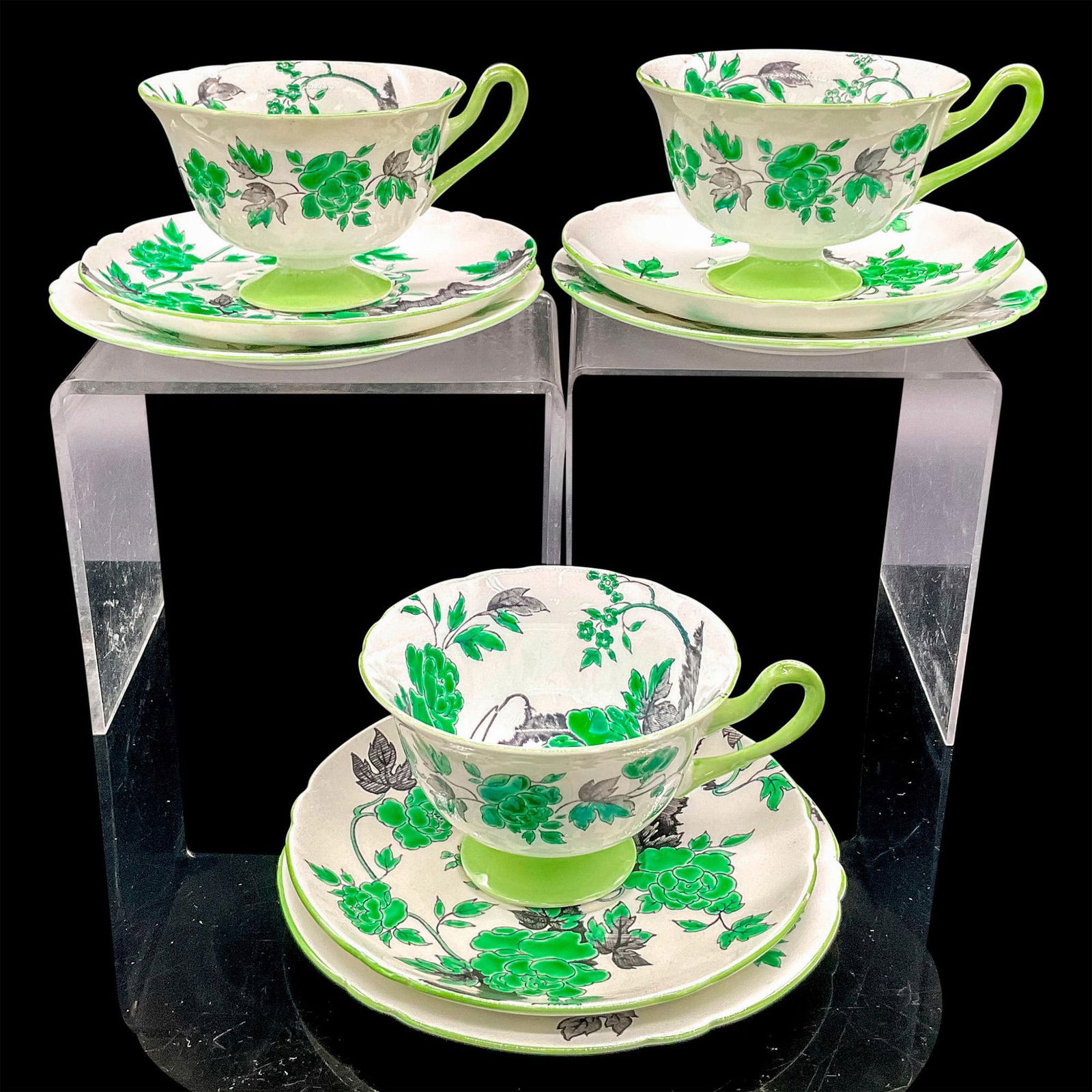 9pc Shelley England Tea Set Trios, Ovington: Vintage white bone china with green flowers, charcoal branches and green rims. Three tea cups, three saucers and three sandwich plates. Milton shape. Tea cups 4.75"L x 4"W x 2.5"H. Saucers 0.75"H x 5.