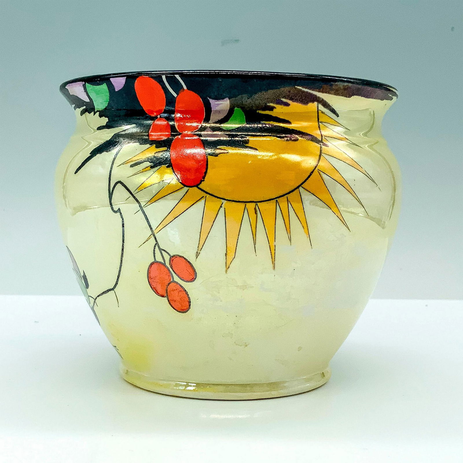Shelley Pottery Tomato Vine Bowl: A yellow bowl depicting the sun shining down on a growing tomato vine with two butterflies on the design as well. Shelley backstamp. Dimensions: 4"H x 4.5" dia. Manufacturer: Shelley Country of Origin