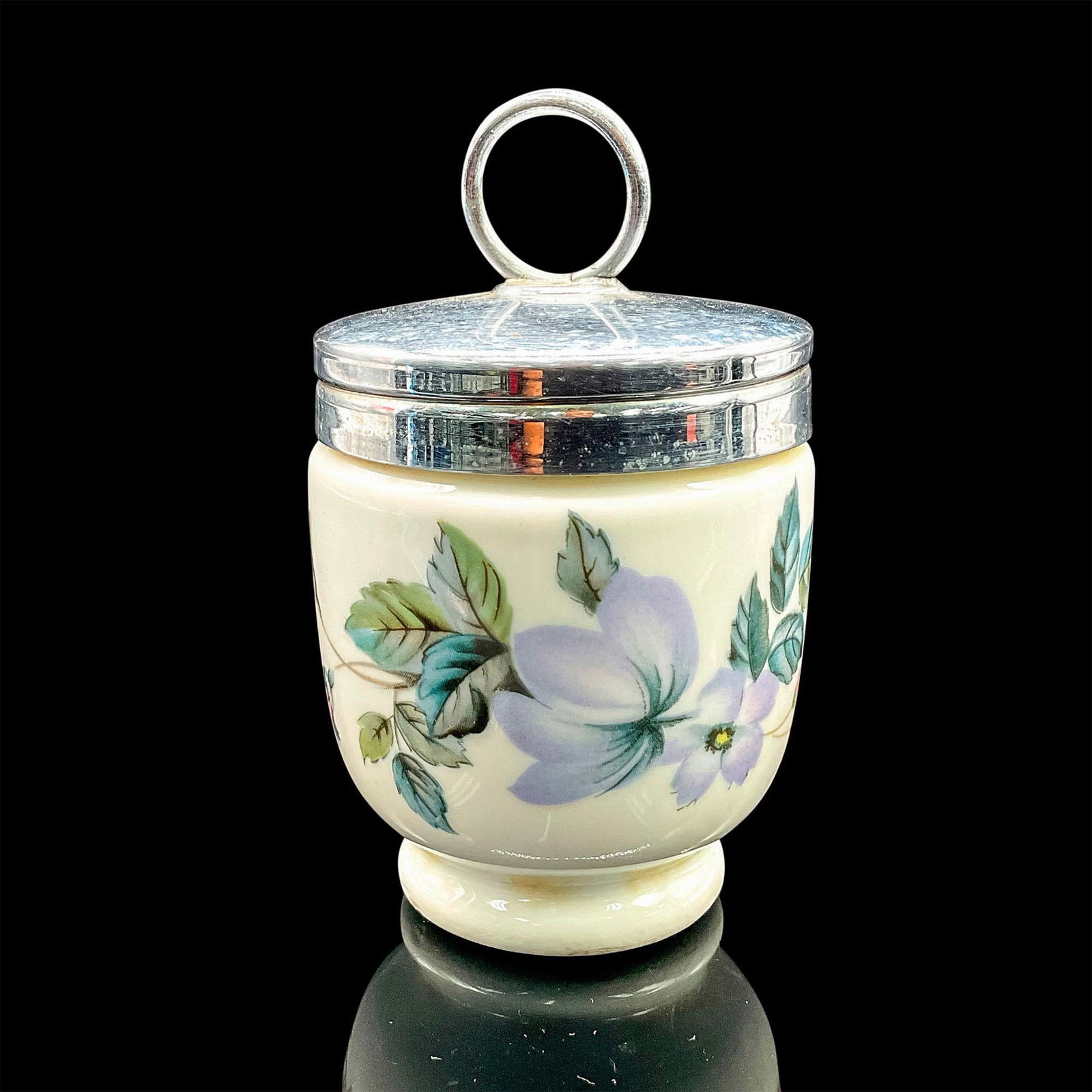 Royal Worcester Egg Coddler, Flowers: Small white porcelain oven-safe egg cup with silvertone lid and floral motif. Royal Worcester backstamp. Dimensions: 3.75"H x 2"dia Manufacturer: Royal Worcester Country of Origin: England