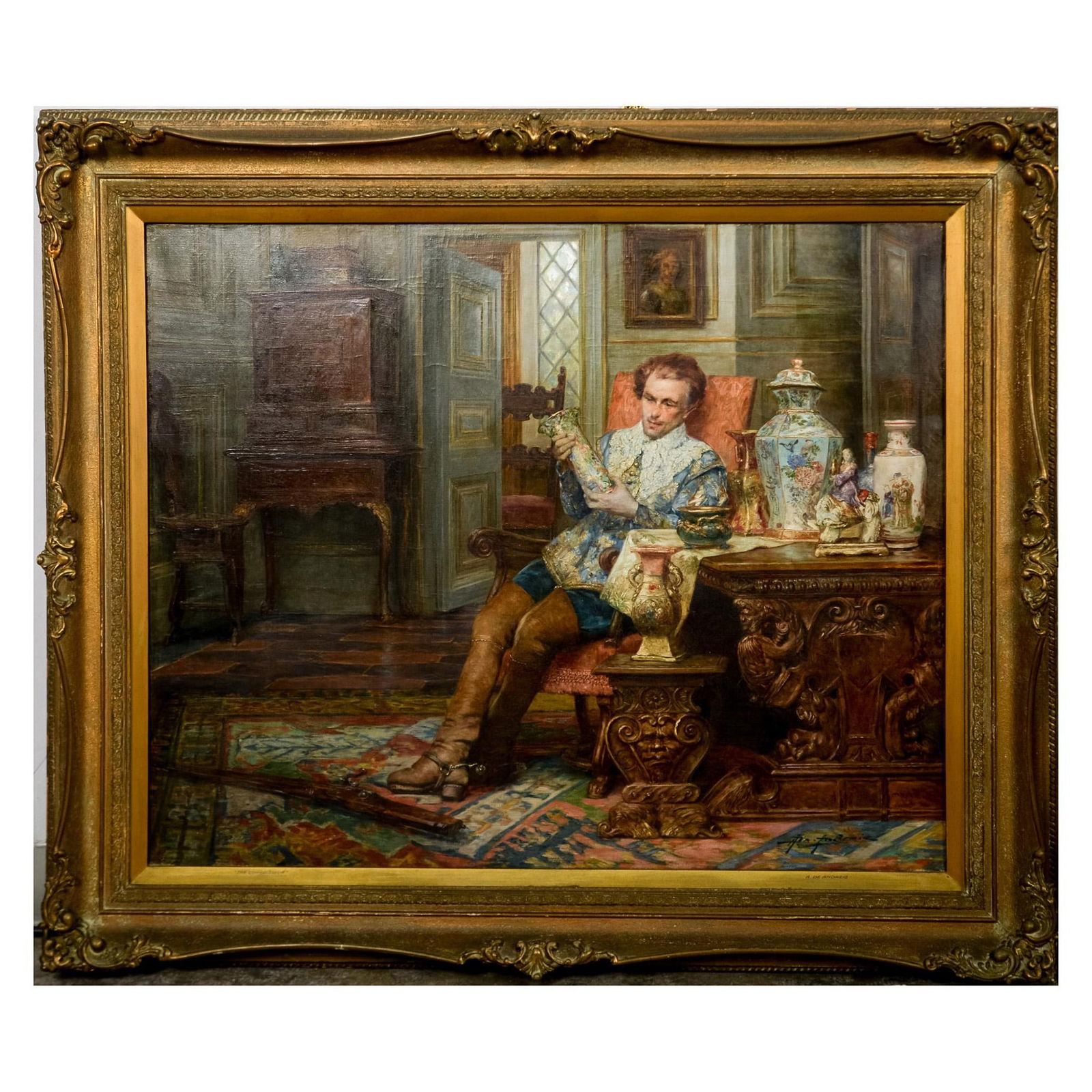 Alex de Andreis (Belgian, 1880-1929) Original Oil on Canvas: Exceptional oil on canvas painting entitled "Le Connoisseur" that depicts an interior scene of a cavalier in regal silk clothes wearing leather riding boots and a firearm on the carpet. The man is adm