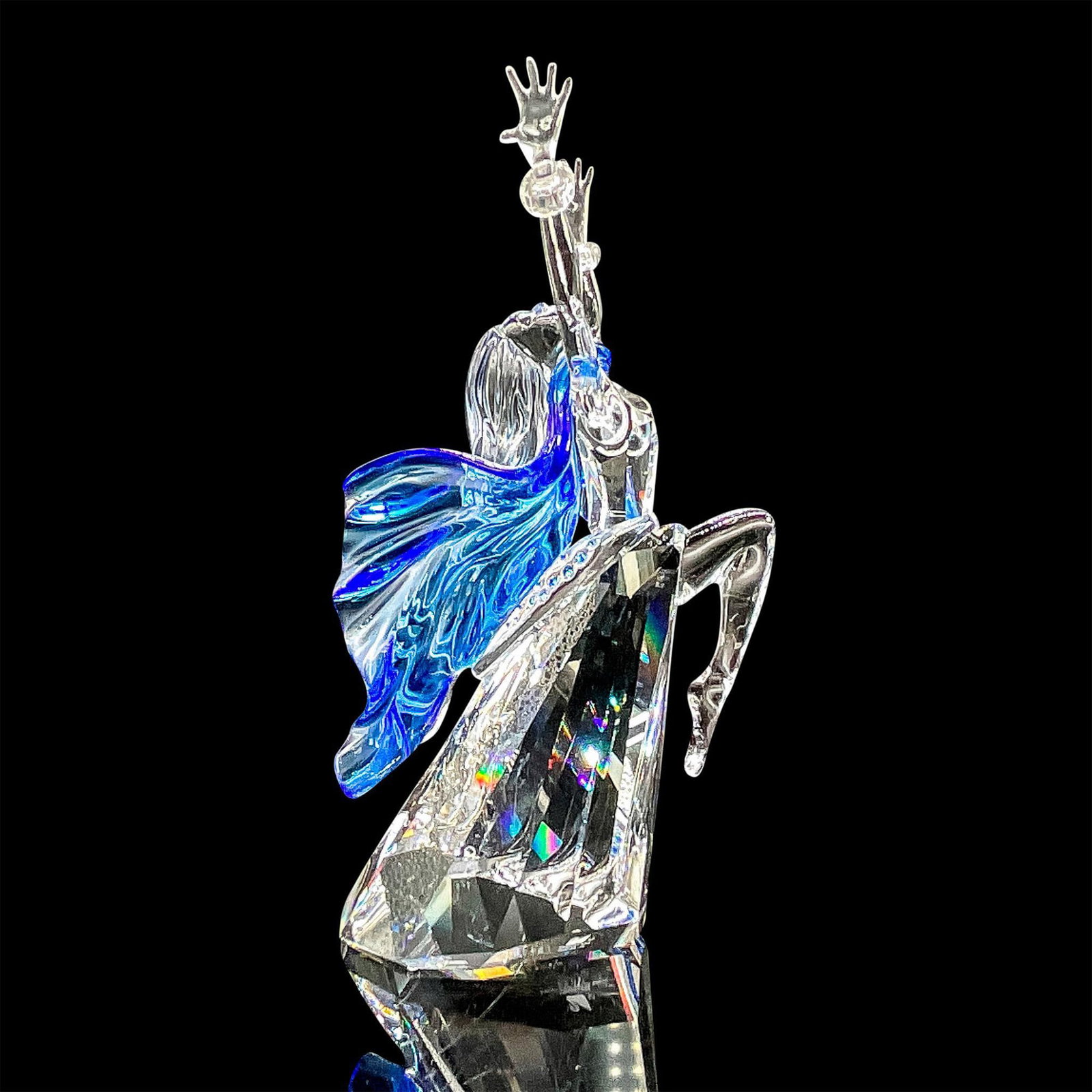 Swarovski Crystal Figurine, Magic of Dance, Isadora 2002: Spectacular clear crystal figure of Isadora, celebrating the art of dance. A blue scarf around her neck flows to the back. Blue crystals are embedded along the back. Swarovski etched mark. Certificate