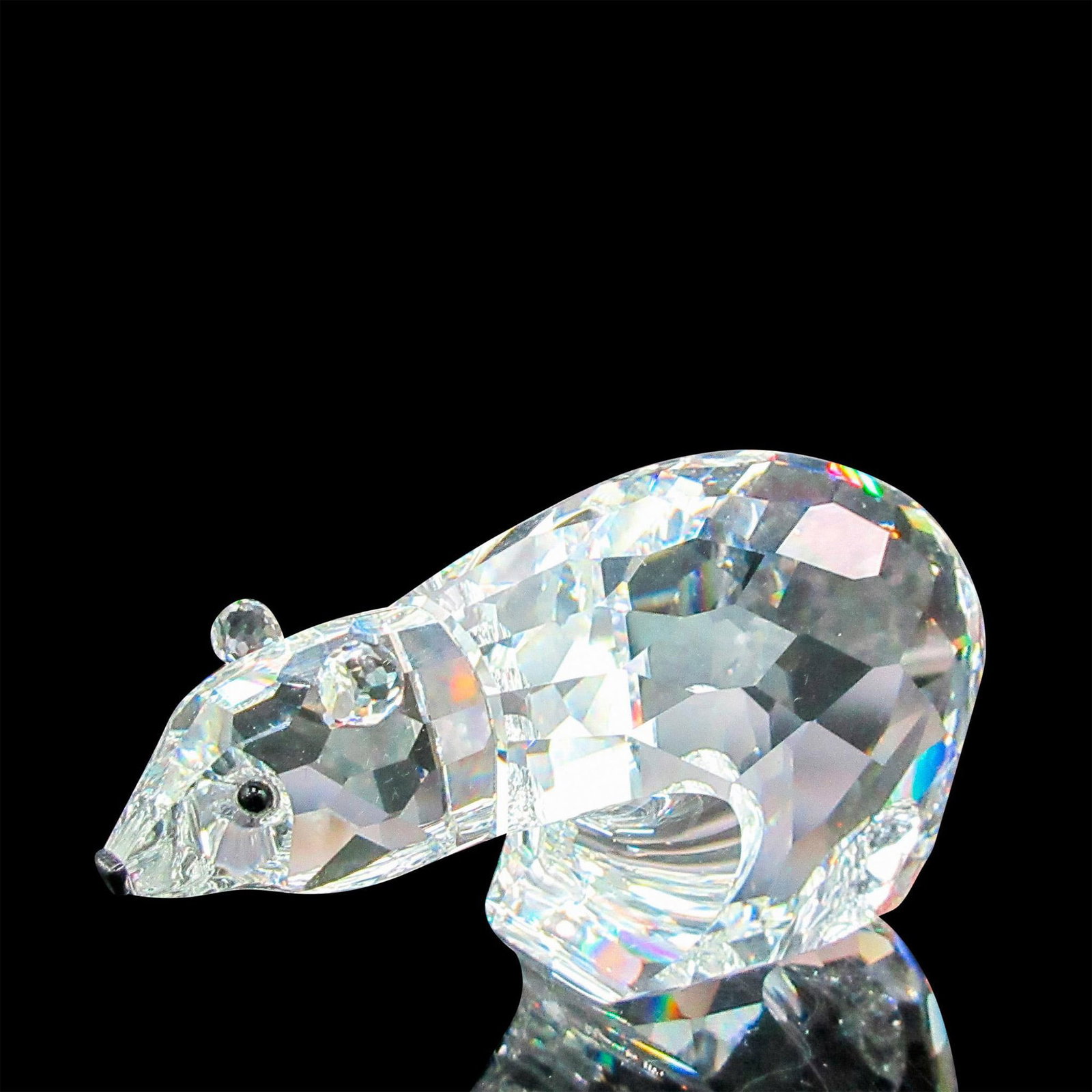 Swarovski Crystal Figurine, Polar Bear: Small figurine with black facet eyes and nose. This item has its original box: 3.25"L x 3.25"W x 6.25"H. Certificate of Authenticity included. Dimensions: 3.5"L x 1.5"W x 2"H Manufacturer: Swarovski C