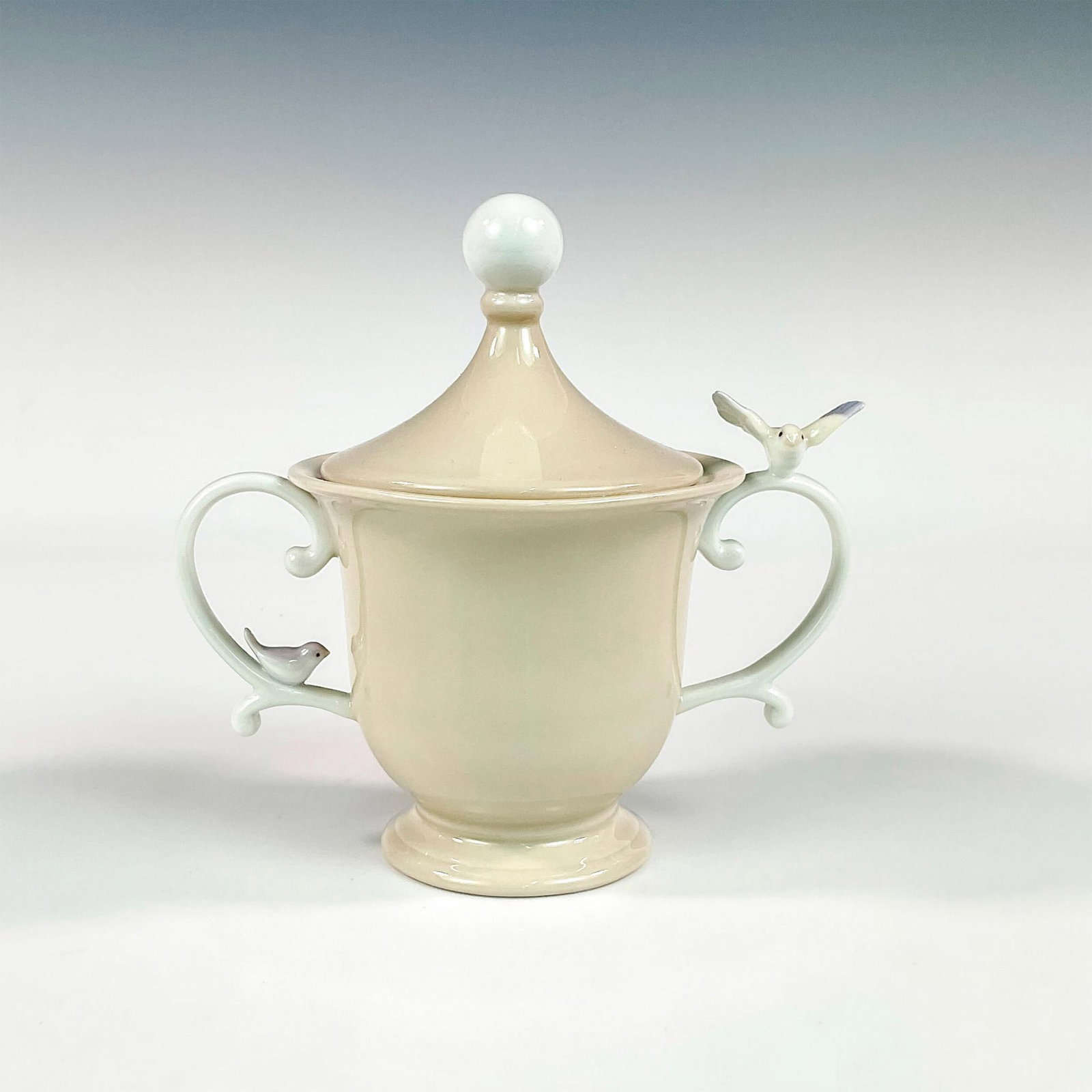 Sugar Bowl 1006041 - Lladro Porcelain Figurine: Glossy finish; Lladro backstamp. Includes original box measuring 9"L x 10.5"W x 6.5"H. Artist: Design & Decoration Dept. Issued: 1994 - 2000 Dimensions: 5"H Manufacturer: Lladro Country of Origin: