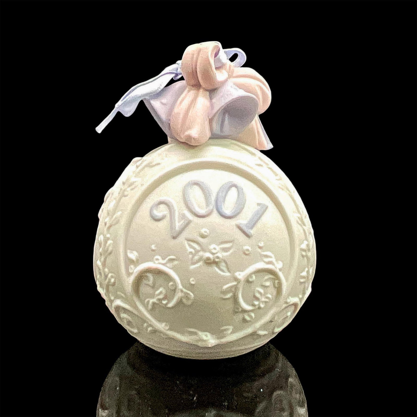 2001 Christmas Ball 1016717 - Lladro Porcelain Ornament: Matte finish; Lladro backstamp. Includes original box measuring 4.5"L x 5"W x 4"H. Artist: Virginia Gonzalez Issued: 2001 - 2001 Dimensions: 3.25"H Manufacturer: Lladro Country of Origin: Spain