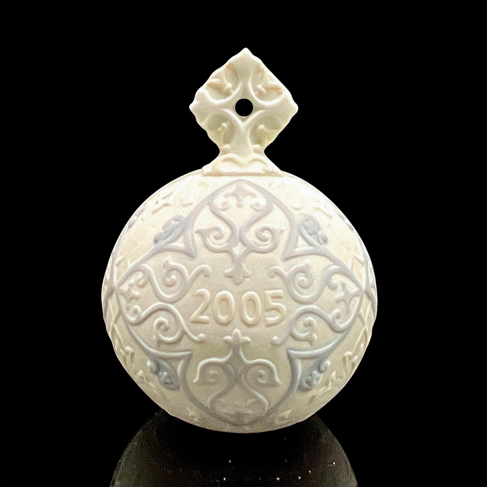 2005 Christmas Ball 1018184 - Lladro Porcelain Ornament: Matte finish; Lladro backstamp. Includes original box measuring 5"L x 4.5"W x 4"H. Artist: Design & Decoration Dept. Issued: 2005 - 2005 Dimensions: 4.25"H Manufacturer: Lladro Country of Origin: