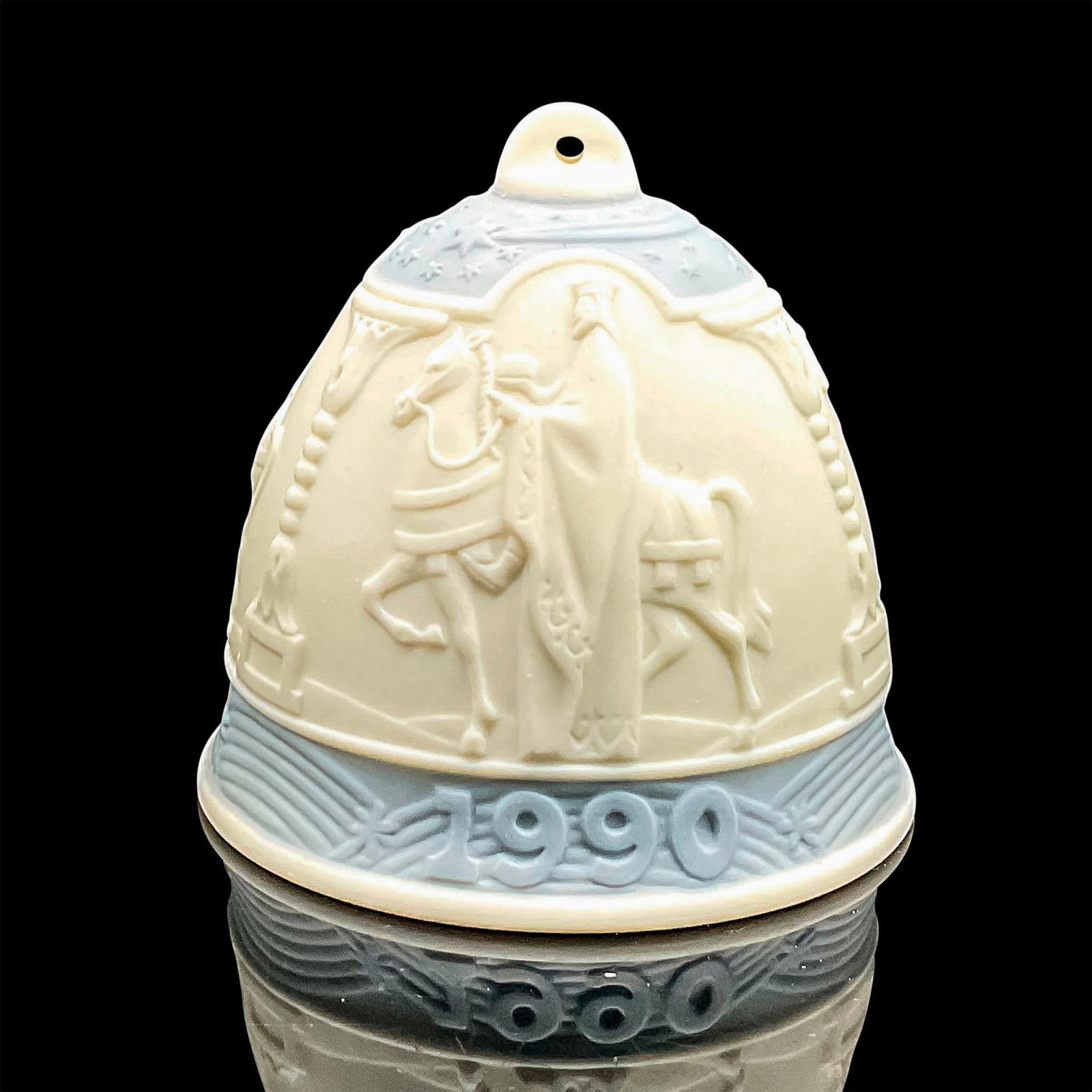 1990 Christmas Bell 1015641 - Lladro Porcelain Ornament: Matte finish; Lladro backstamp. Includes original box measuring 4.5"L x 5"W x 4"H. Artist: Jose Roig Issued: 1990 Dimensions: 2.75"H Manufacturer: Lladro Country of Origin: Spain