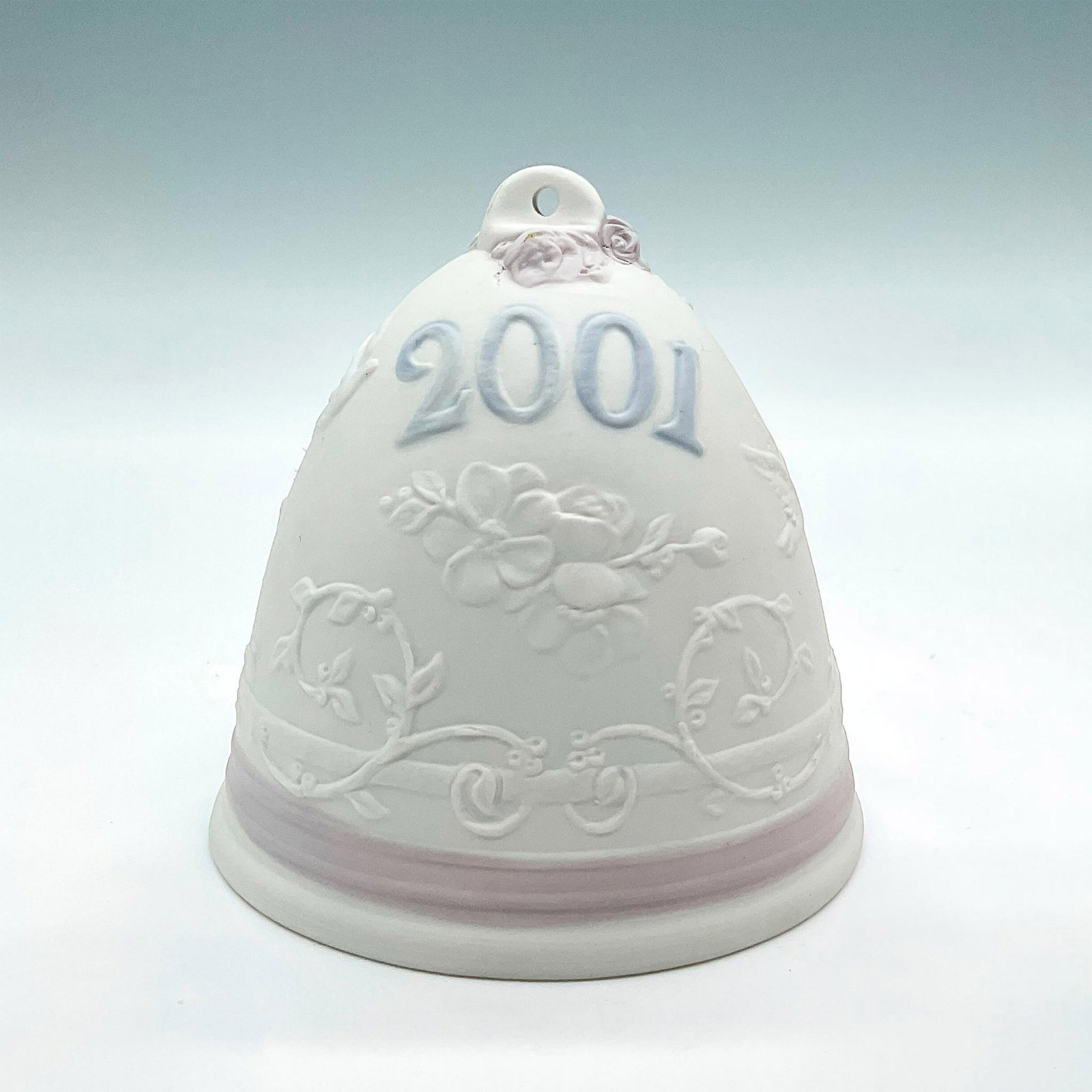 2001 Christmas Bell 1016718 - Lladro Porcelain Ornament: Matte finish; Lladro backstamp. Includes original box measuring 4.5"L x 4.75"W x 4"H. Artist: Virginia Gonzalez Issued: 2001 - 2001 Dimensions: 3.5"H Manufacturer: Lladro Country of Origin: Spain<