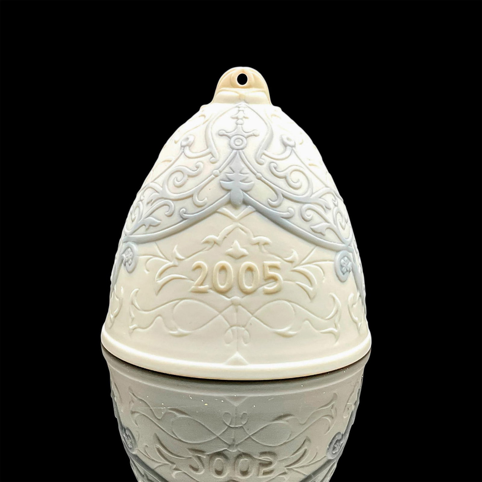 2005 Christmas Bell 1018185 - Lladro Porcelain Ornament: Matte finish; Lladro backstamp. Includes original box measuring 4.75"L x 4.5"W x 4"H. Artist: Design & Decoration Dept. Issued: 2005 - 2005 Dimensions: 3.25"H x 3.25"W Manufacturer: Lladro Country of