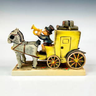 Goebel Hummel Figurine, The Mail Is Here: Hand painted in matte finish modeled as a horse-drawn carriage with lad blowing a horn to announce his arrival with the mail. M. I. Hummel impressed backstamp. Goebel backstamp. Dimensions: 6.25"L x 2