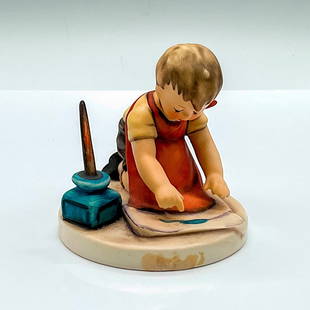 Goebel Hummel Porcelain Figurine, With Loving Greetings: Hand painted figure of a young boy writing a letter on a large piece of paper. Goebel Hummel backstamp. HUM 309. Issued: c. 1979-1990 Dimensions: 4"L x 3.5"W x 3.5"H Manufacturer: Goebel Hummel Countr