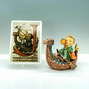 2pc Goebel Hummel Figurine and Postcard, Brave Voyager: A figure of a young child sitting on a canoe holding a horn with a small yellow bird accompanying him along with a postcard matching in design. Goebel Hummel backstamp. Dimensions of the Figure: 6"L