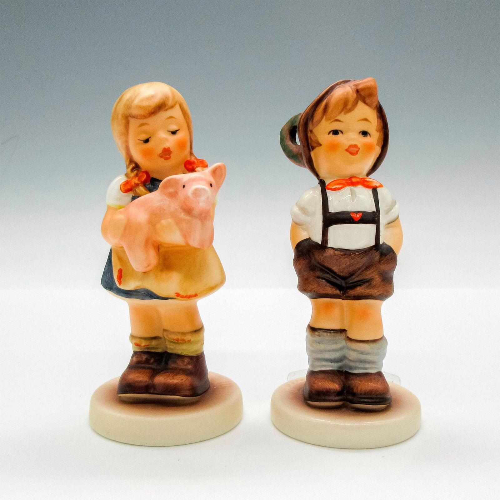 2pc Goebel Hummel Figurines, Pigtails 2052: Matte finished, hand painted figures of children 2052 and For Keeps 630. Marked M.I. Hummel Club Membership Year 1994/95 and 1999/2000. Goebel backstamp. Largest piece: 1.5"L x 1.5"W x 3.5"H. Issued: