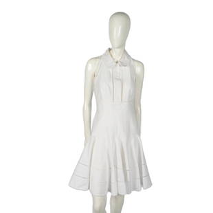 Louis Vuitton Cotton Summer Dress: Exquisite white textured dress with round collar, square trail cutouts, and beautiful flared skirt-like end with looping pattern. Louis Vuitton label. Size: 38. Dimensions: 38"L x 15"W