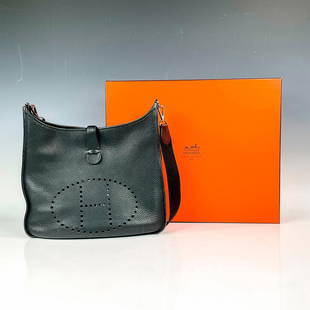 Hermes Clemence Leather Evelyne Bag: Chic black sophisticated leather satchel purse with girth-like shoulder strap. Features a semi-matte smooth feel with the perforated â€œH” in front of bag. Includes dust bag. Hermes Paris