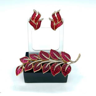 2pc Trifari Faux Ruby Leaf Frond Brooch and Clip On Earrings: Beautiful gold metal set with faux rubies and clear rhinestones. The pin measures 3.75"L x 1.5"W. The clip on earrings measure 1.25"L x 0.75"W. Manufacturer: Trifari Country of Origin: United States