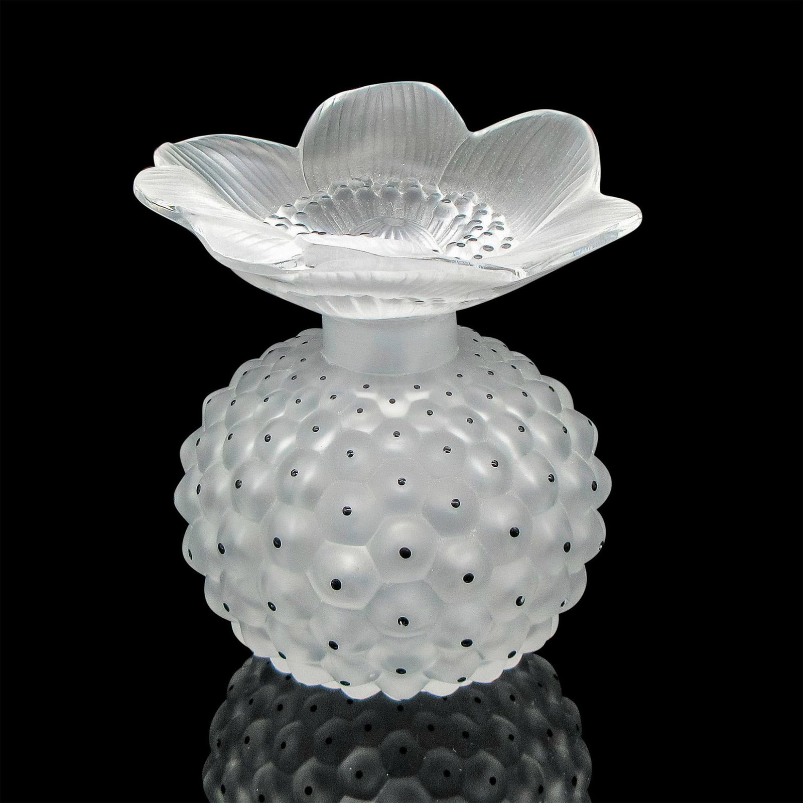 Lalique Frosted Perfume Bottle and Stopper, Cactus: Frosted, dimple design with black crystals. Stopper is frosted floral with center dimpled design with black crystals. Lalique etched mark on stem of stopper and base of bottle. Measures: 3.5"L x 3.5"W