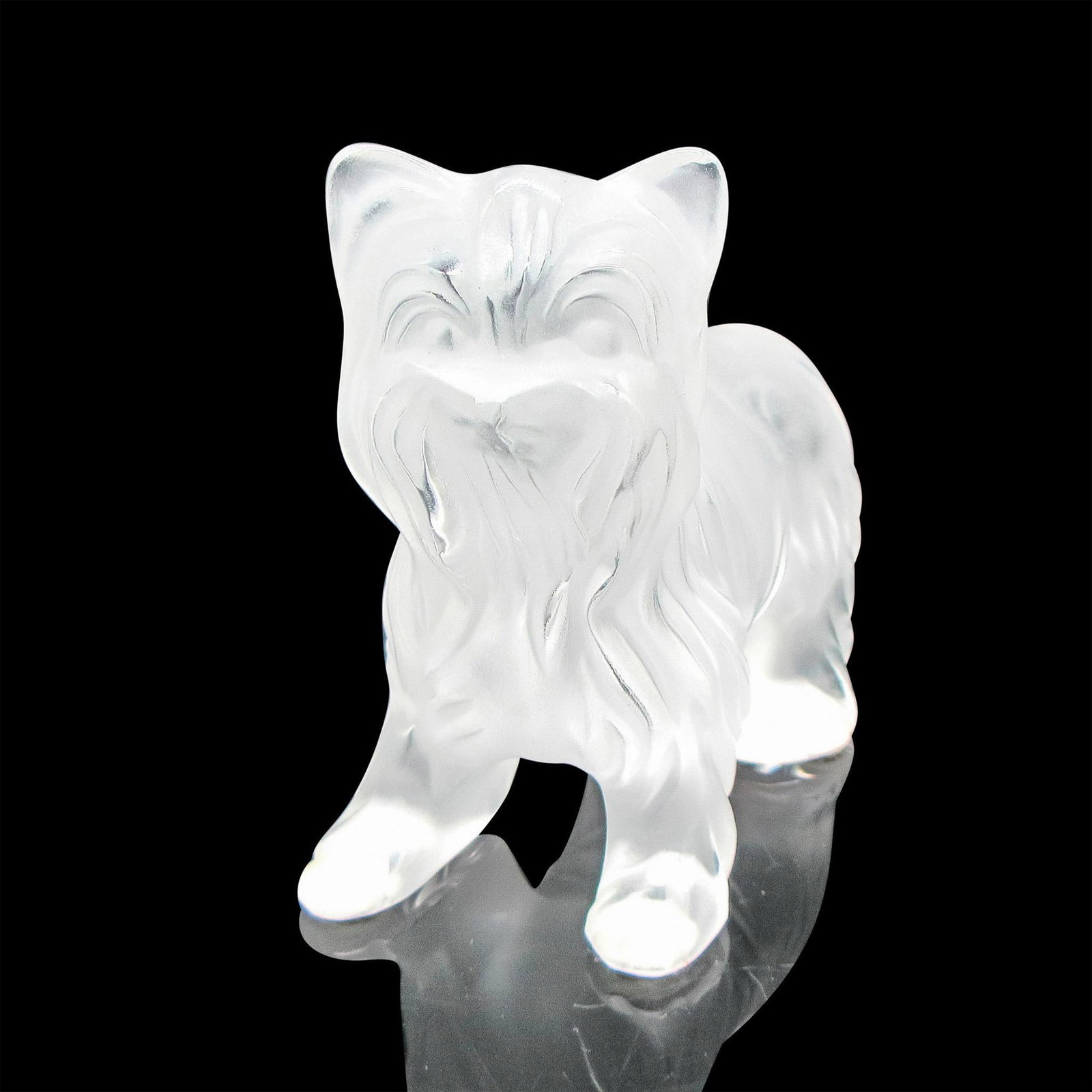 Lalique Crystal Figurine, Yorkshire Terrier: Standing frosted crystal figural of dog with defined hair coat. Lalique etched mark. Issued: 20th century Dimensions: 3.5"L x 1.75"W x 3.75"H Manufacturer: Lalique Country of Origin: France