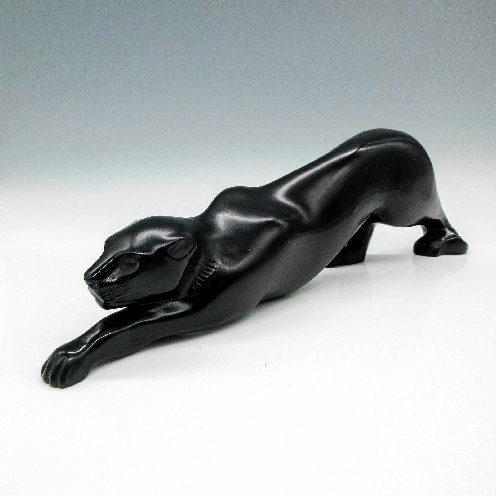 Marie-Claude Lalique (French, 1935-2003) Black Crystal Sculpture, Zeila Panther: Art deco style in sleek, stalking feline. Lalique etched mark. Artist: Marie-Claude Lalique (French, 1935-2003) Issued: c. 2009 Dimensions: 14"L x 3"W x 4"H Manufacturer: Lalique Country of Origin:</