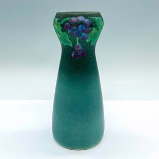 Rookwood Pottery by Charles Todd Vellum Vase, Blue Berries: A small green-blue vase adorned with blue berries on the top. Rookwood Pottery and artist's initials on the base. Artist: Charles Stewart Todd Issued: 20th century Dimensions: 3.25"W x 7.25"H Manufact