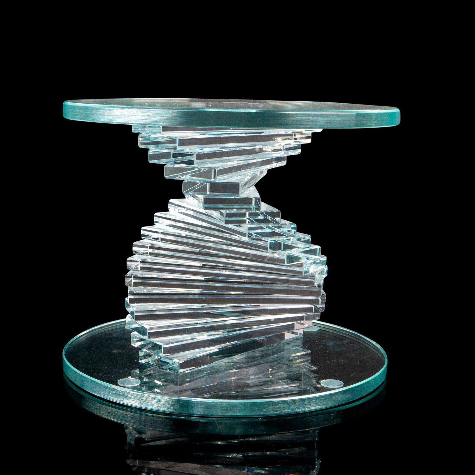 Helix Spiral Modern Glass Base: A clear stand for a vase or figurine with a spiral column between a disk-shaped top and bottom. Dimensions: 10"W x 8"H Provenance: Marie-Claude Lalique private collection.