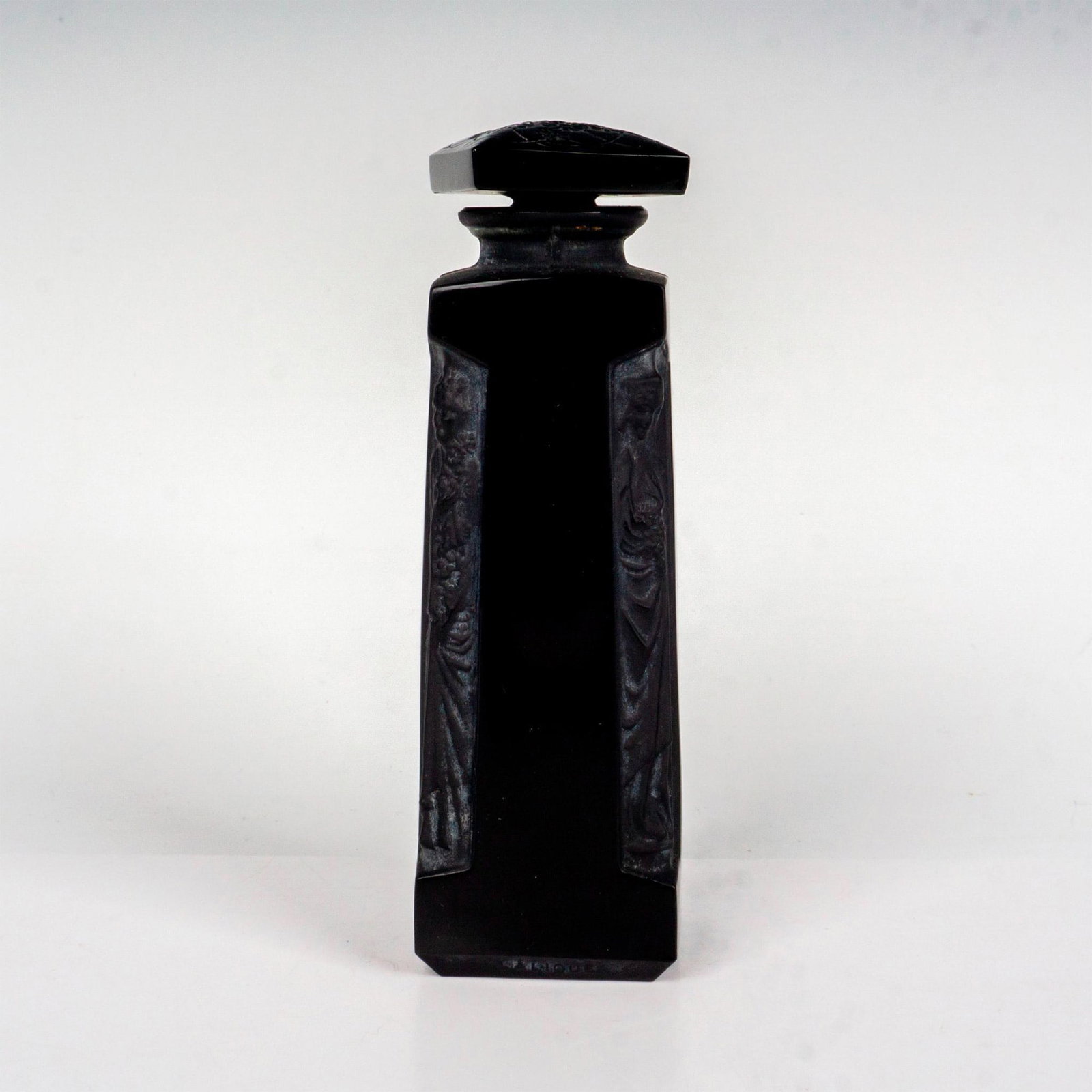 Rene Lalique For Dorsay Perfume Bottle: An ombre d'Orsay black glass vessel, polished and frosted featuring four Grecian figures. Floral design on the stopper. Ambre D'Orsay Lalique impressed to side. Artist: Rene Lalique Issued: c. 1914 Di