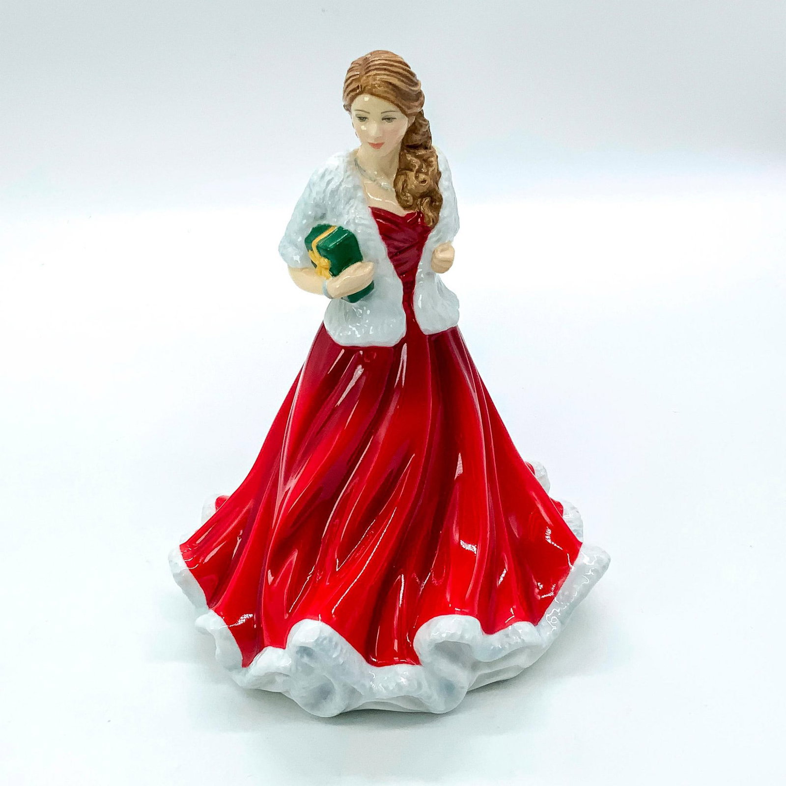 Glad Tidings Petite FOY 2018 HN5892 - Royal Doulton Figurine: Christmas Day Petite Series. Royal Doulton backstamp. Comes with original box with dimensions: 9.25 in. L x 7 in. W x 6.25 in. H. Artist: Neil Faulkner Issued: 2018 Dimensions: 7"H Manufacturer: Royal