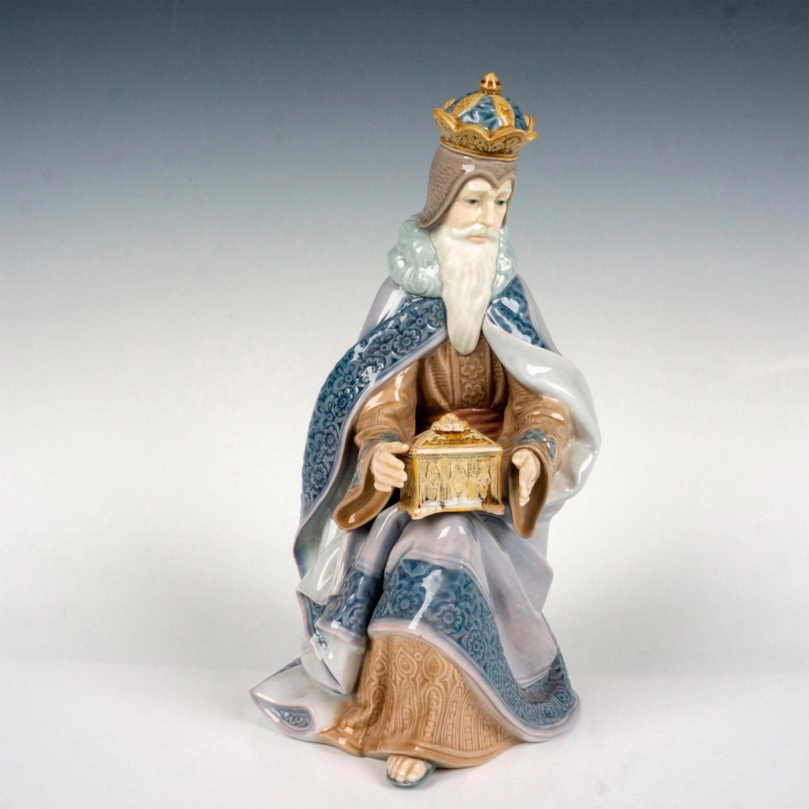 King Melchior 1001423 - Lladro Porcelain Figurine: Glossy finish; Lladro backstamp. Artist: Salvador Furio Issued: 1982 - 2007 Dimensions: 10"H x 6.5"W Manufacturer: Lladro Country of Origin: Spain