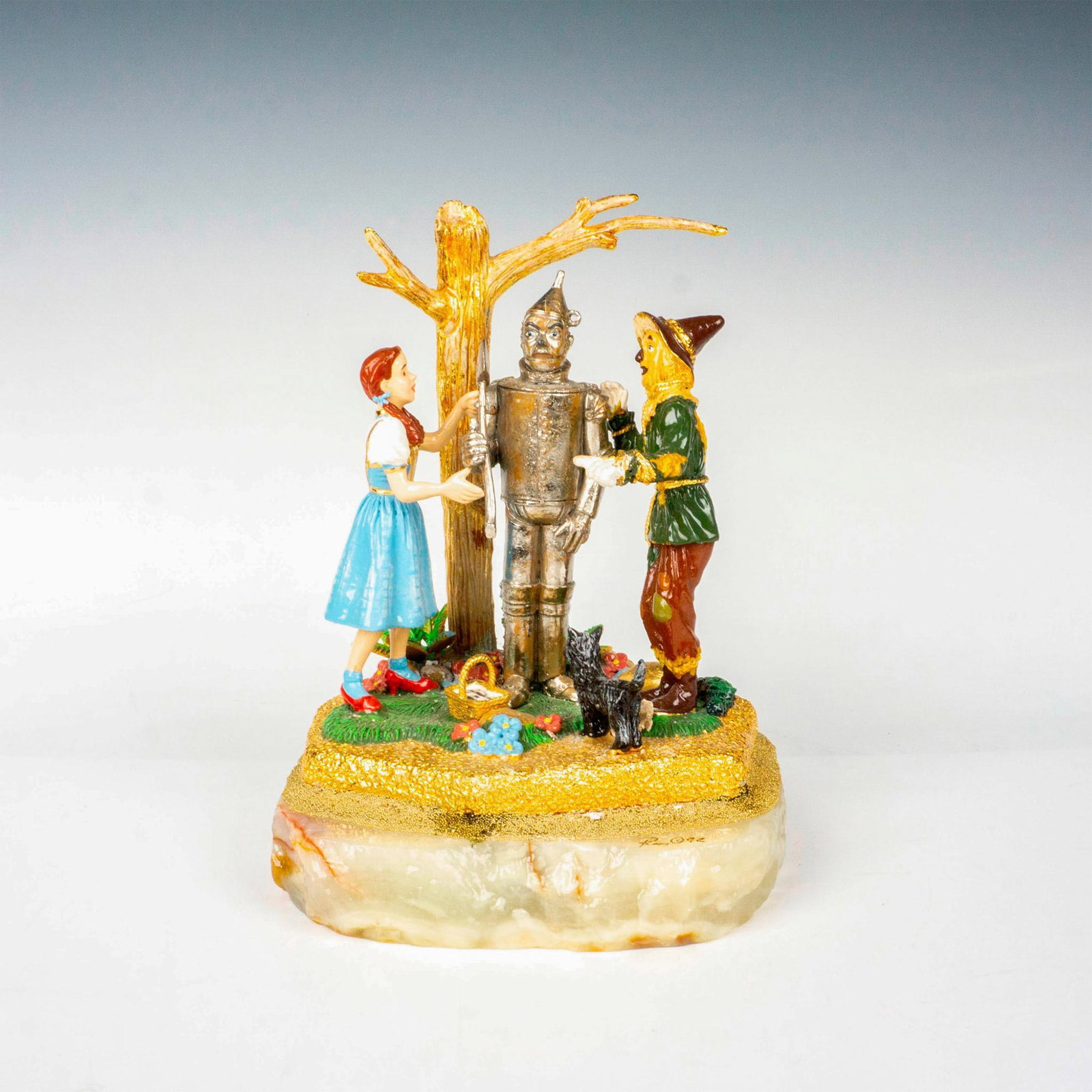 Ron Lee (American 1947-2017), Wizard of Oz Sculpture: Limited edition, hand painted metal featuring a scene from the Wizard of Oz; on onyx base. Heavy gilded decorations. Signed Ron 92. Artist: Ron Lee Issued: 1992 Dimensions: 6.25"L x 6.25"W x 9"H Editi