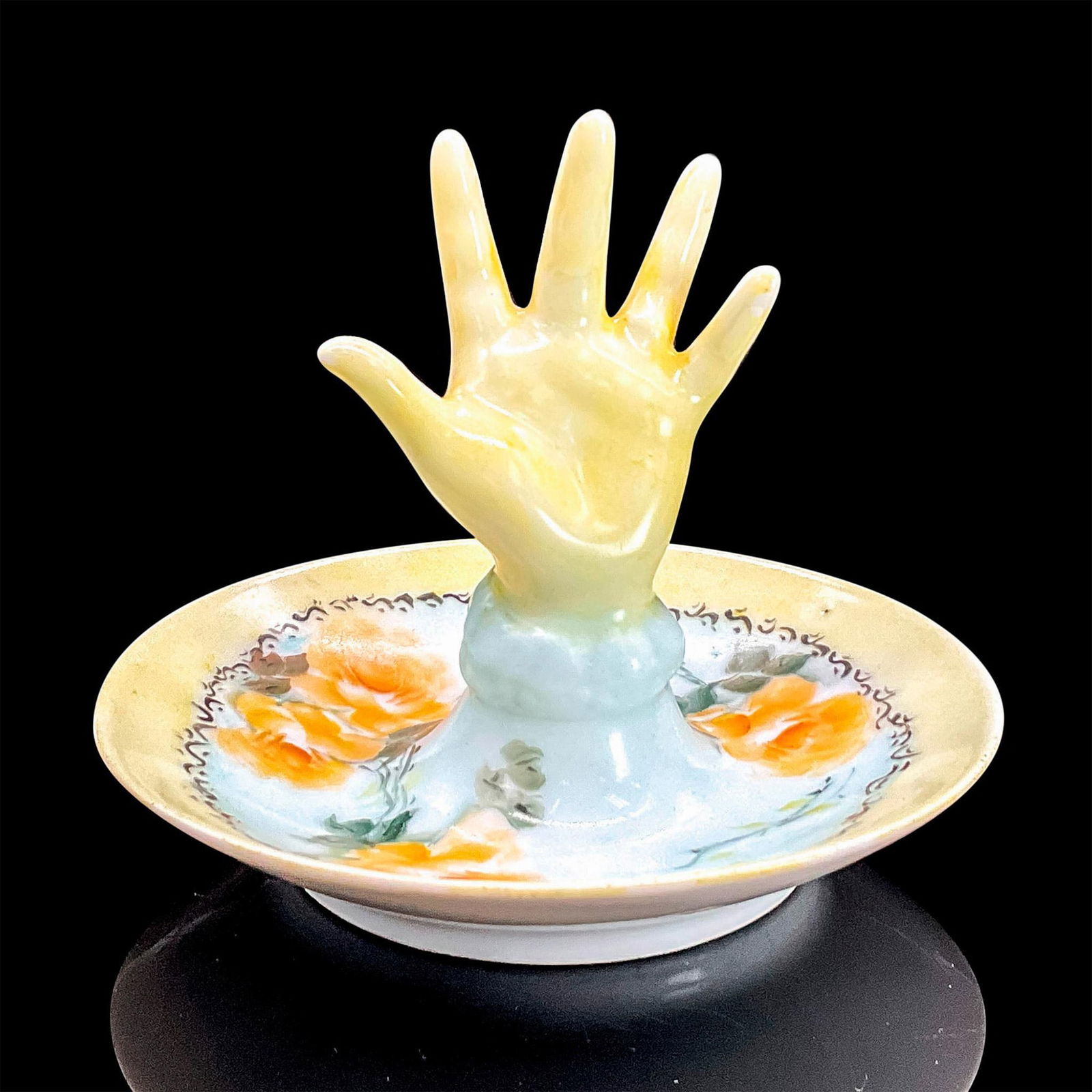 Limoges Porcelain Ring Holder Dish, Hand: Hand painted ring holder dish with in yellow floral motif. Post in the shape of a hand in yellow. Limoges France stamp. Dimensions: 3"H x 3.75"dia