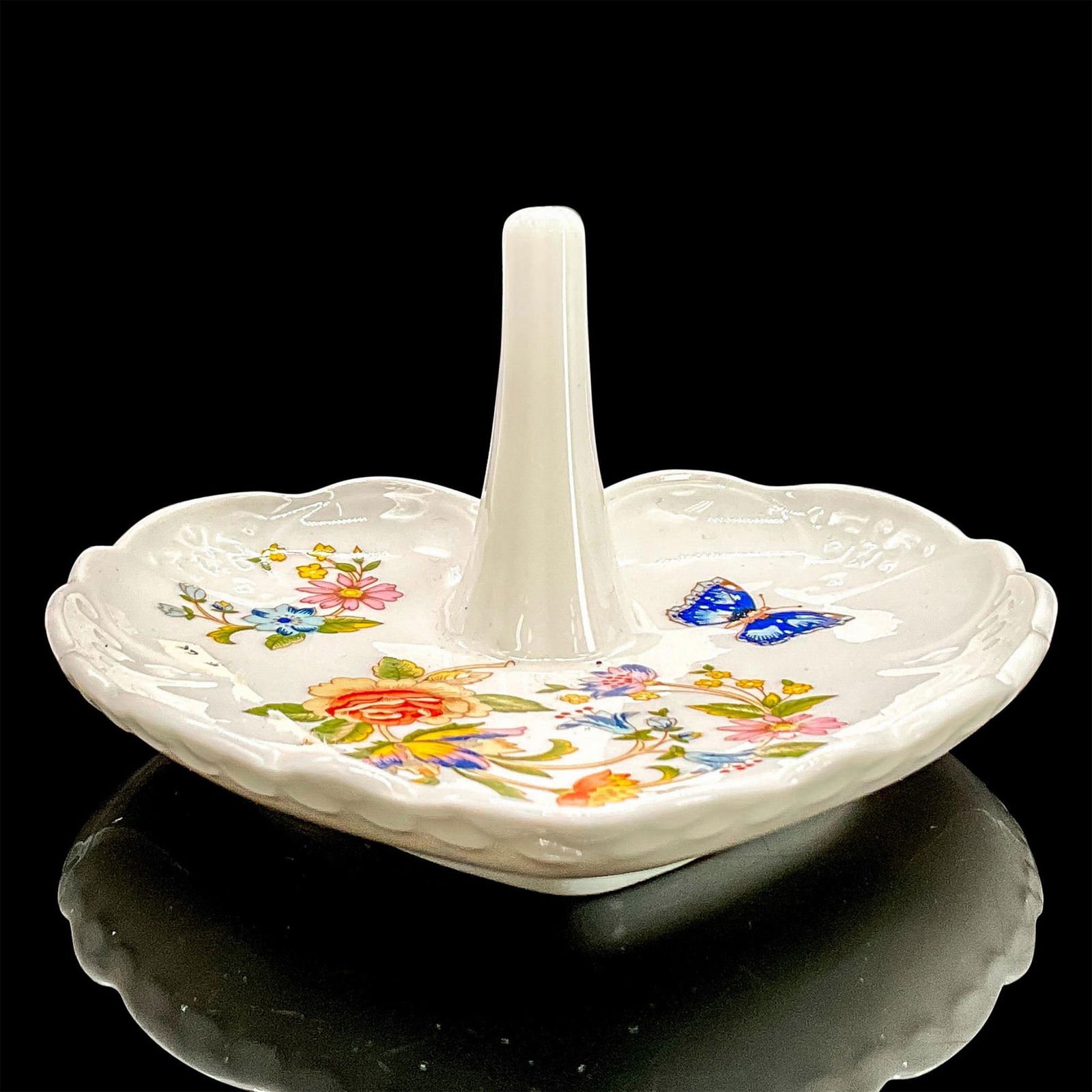 Aynsley Heart Shaped Ring Holder Dish, Cottage Garden: White porcelain dish in a colorful floral and butterfly design. Aynsley backstamp and factory foil label. Dimensions: 4.75"L x 4.5"W x 2.5"H Manufacturer: Aynsley China Country of Origin: England