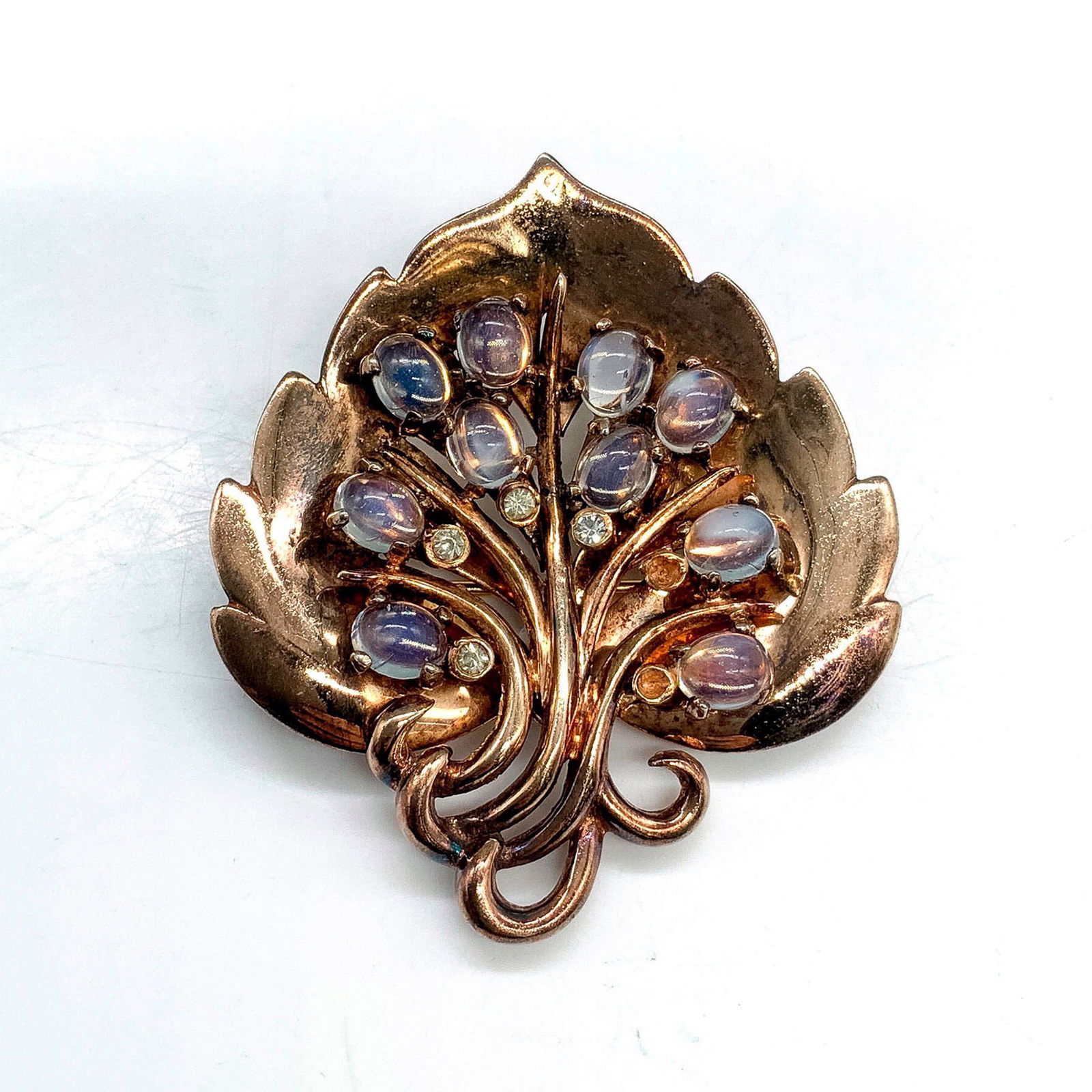 Beautiful Gold Washed Sterling and Moonstone Leaf Brooch Pin: Unmarked silver leaf brooch with ten oval moonstone cabochons. Dimensions: 2"L x 1.75"W