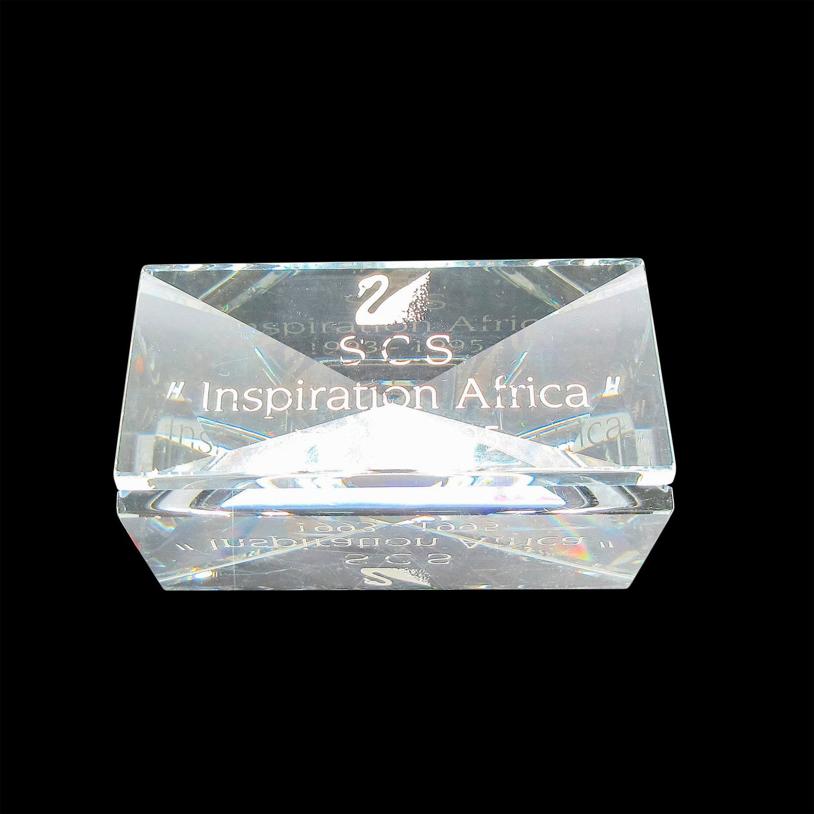 Swarovski Silver Crystal Plaque, Inspiration Africa: Clear plaque for Africa 1993 - 1995. Swarovski backstamp on front. This item has its original box: 5"H x 3.25"dia. Issued: 20th century Dimensions: 2.75"L x 1.25"W x 1"H Manufacturer: Swarovski Countr