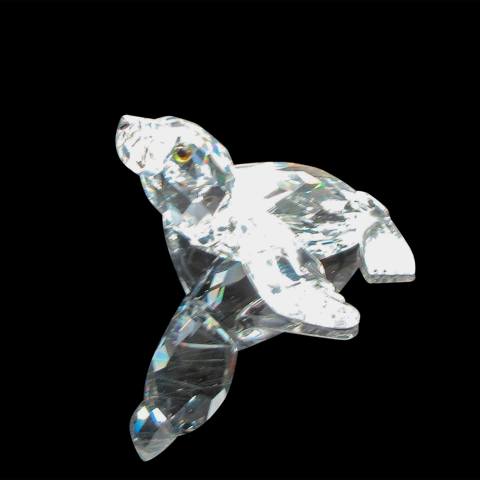 Swarovski Crystal Figurine, Baby Sea Lion: Part of the Aquatic Worlds Collection. Clear body. Black eyes and nose. Swarovski backstamp. 7661 000 004. This item has its original box: 3.75"H x 3.25"dia. Artist: Michael Stamey Issued: c. 1988 Dim